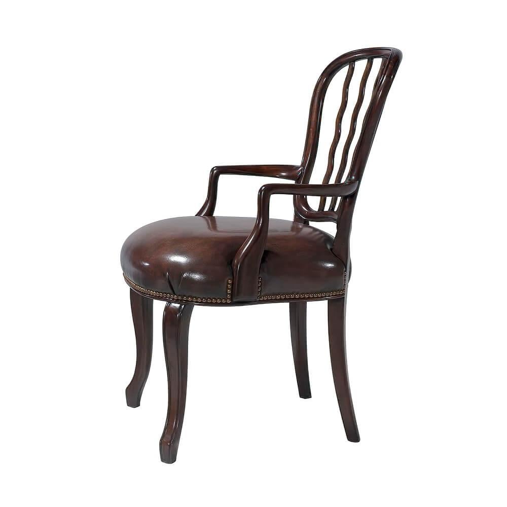 A mahogany dining armchair, the shaped waisted back with serpentine uprights above an upholstered seat, on elegant molded cabriole legs terminating in spade feet. The original very large set designed by George Seddon, circa 1800.

Dimensions: 26