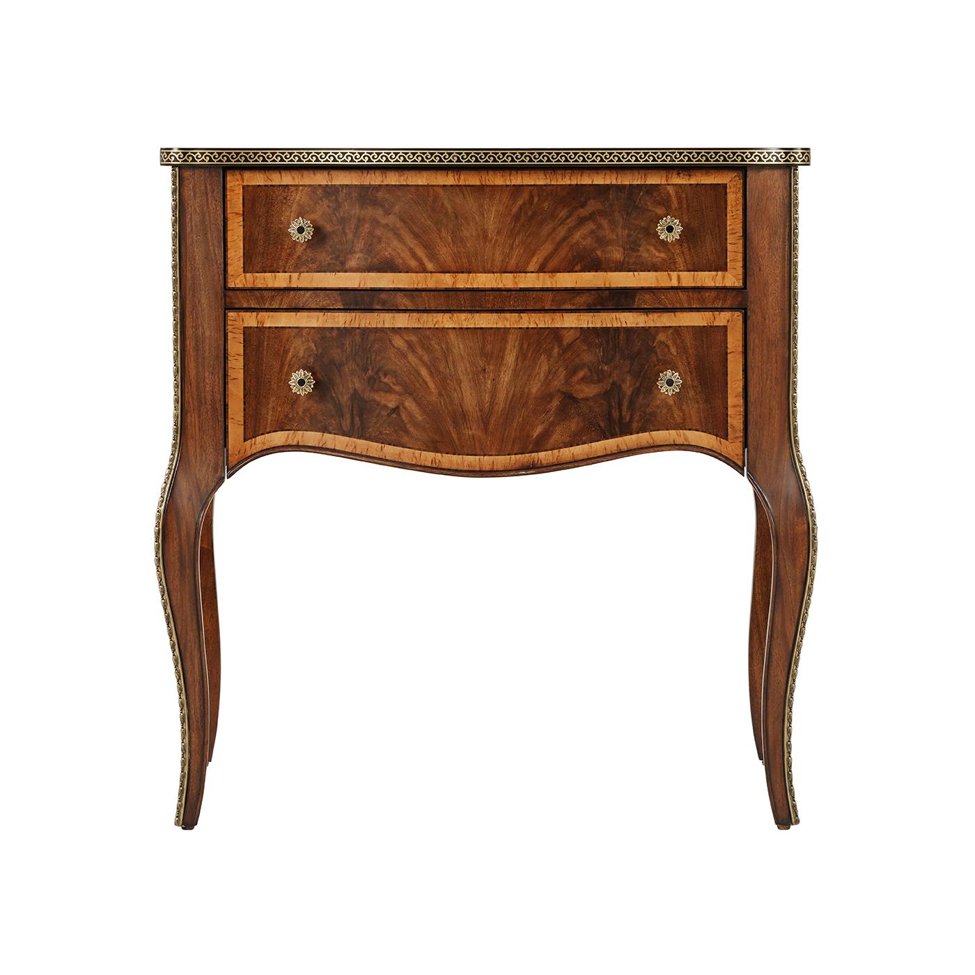 An embodiment of classic elegance and refined craftsmanship. This exquisite piece is crafted from exotic figured woods, showcasing a rich blend of textures and grains. The nightstand is detailed with a timeless brass inlay that beautifully frames