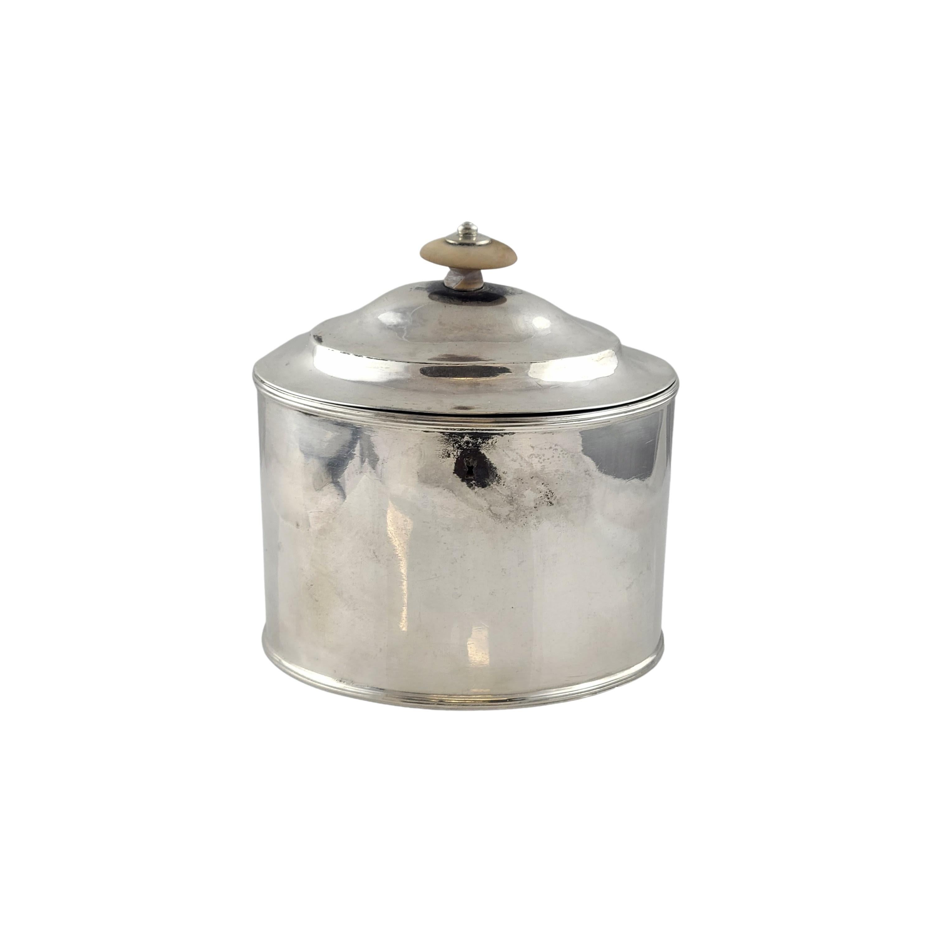 Antique George III era sterling silver tea caddy by renowned London silversmith, Hester Bateman, circa 1782.

Simple but elegant tea caddy by Hester Bateman, known as the 