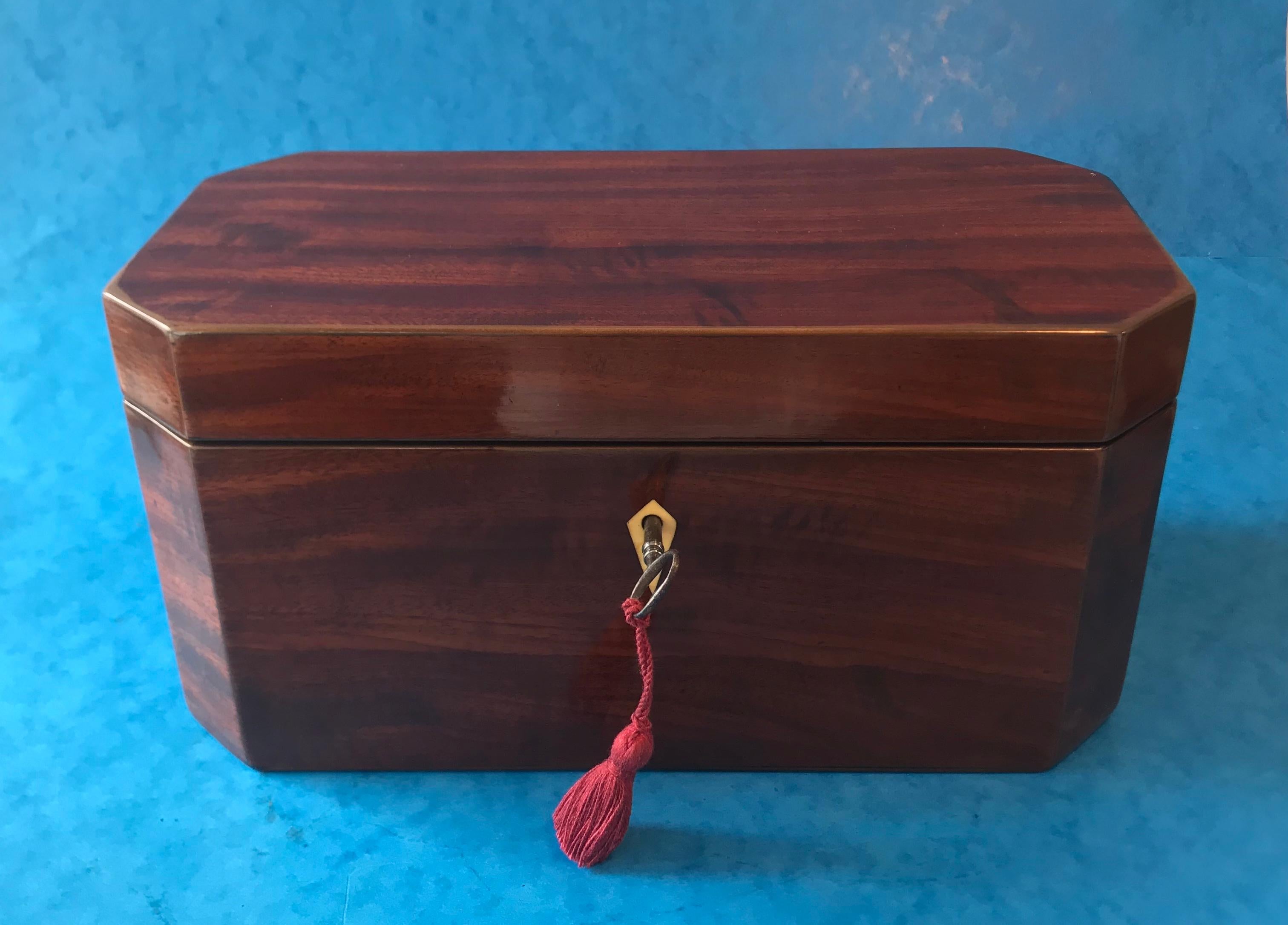 George III hexagonal mahogany tea caddy. Lovely box with cut corner with superb mahogany. The Caddy is in excellent condition with a working original key and lock (GR patent lock). Original interior with super cut crystal bowl, original Moroccan