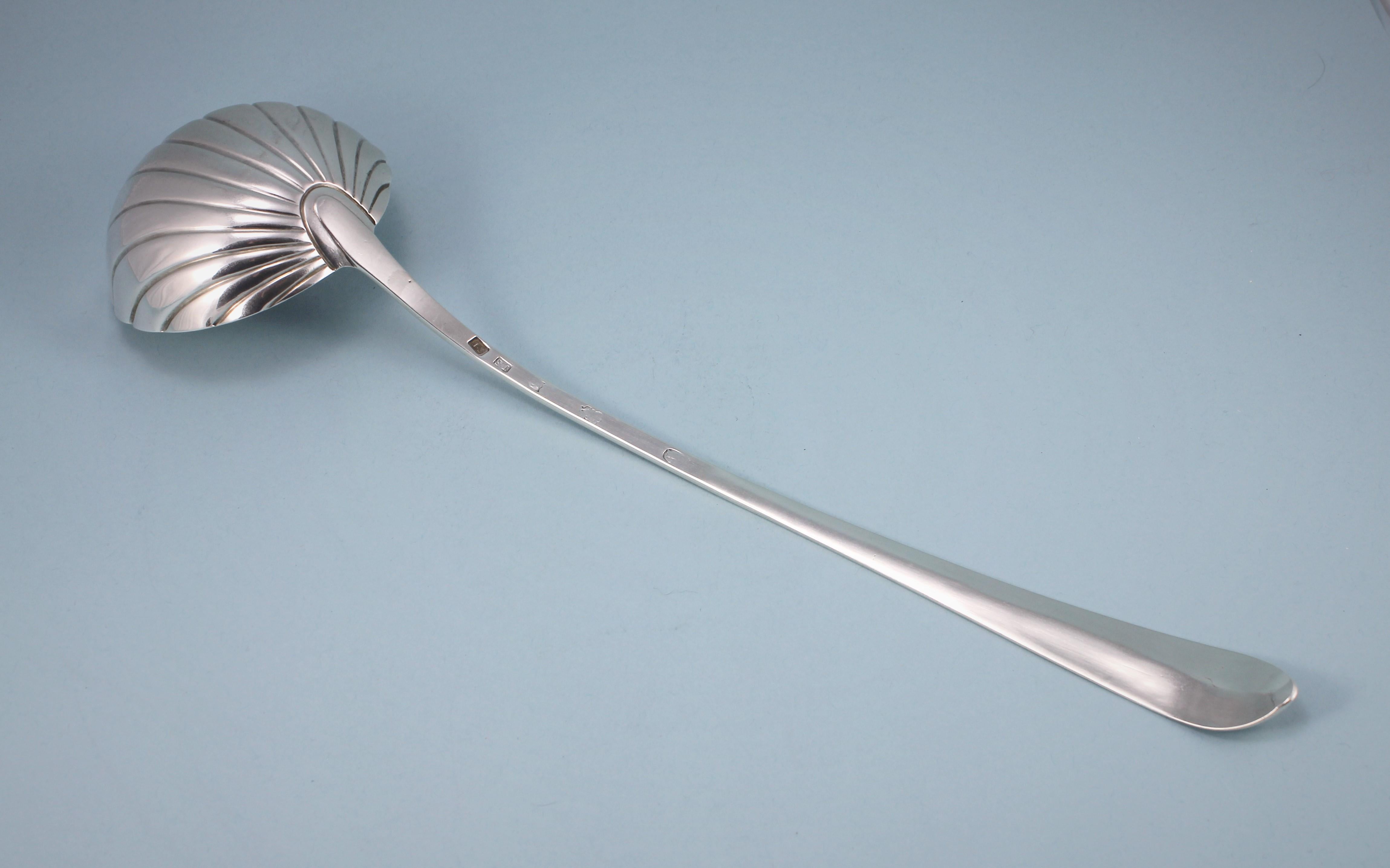 Eye-catching George III Irish bright cut sterling silver soup ladle. 
Maker: John Shields. Dublin 1785. 

The ladle has a fluted circular bowl. The stem has bright cut engraving which is wriggle-edge on the sides and at the top of the pointed