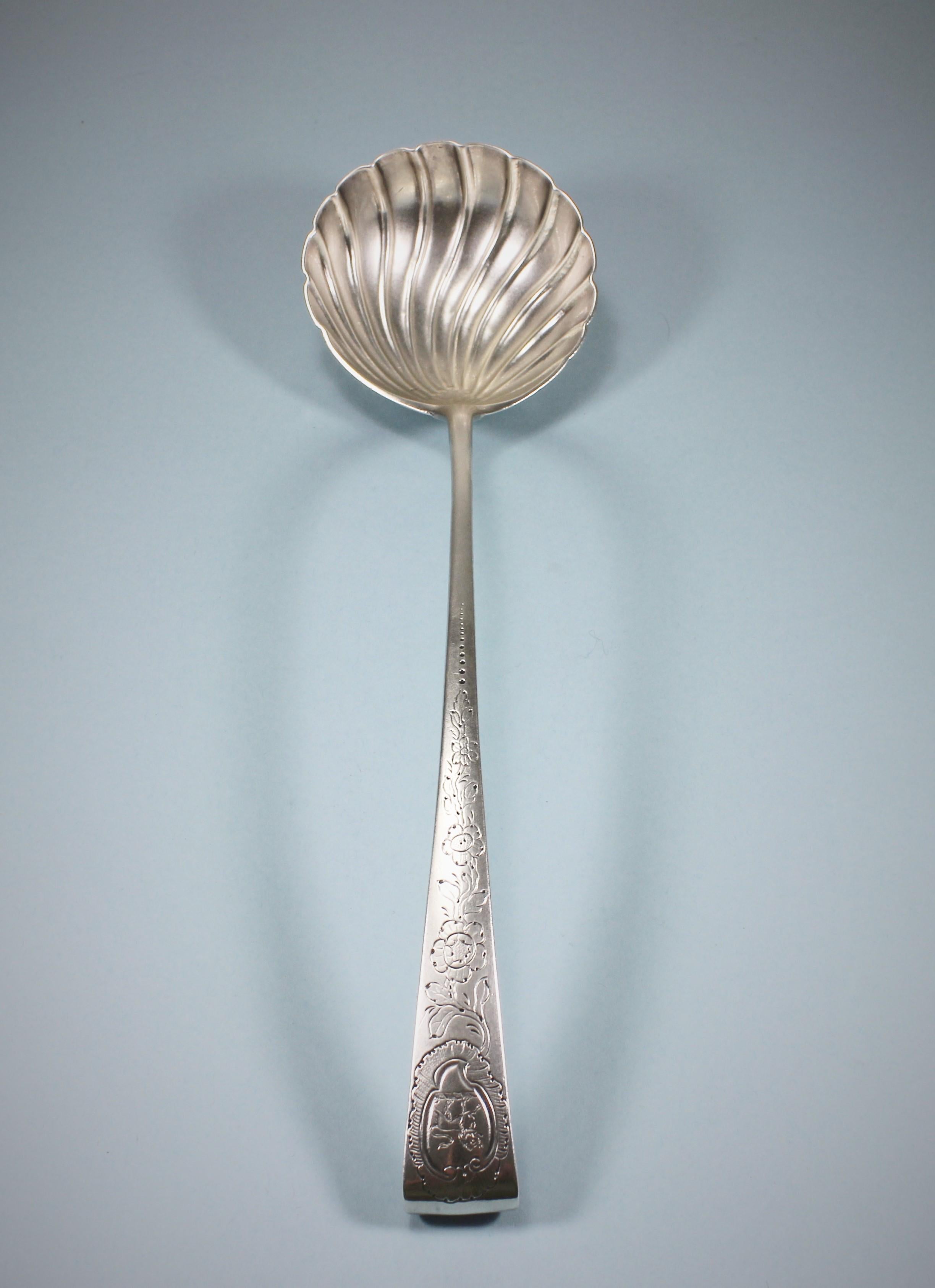 Decorative George III sterling silver shell bowl hook end soup ladle with a typically Irish design. 
Maker: John Loughlin. Dublin 1765. 
The ladle is of a good weight with an attractive shell bowl and a hook end at the tip of the stem. The end