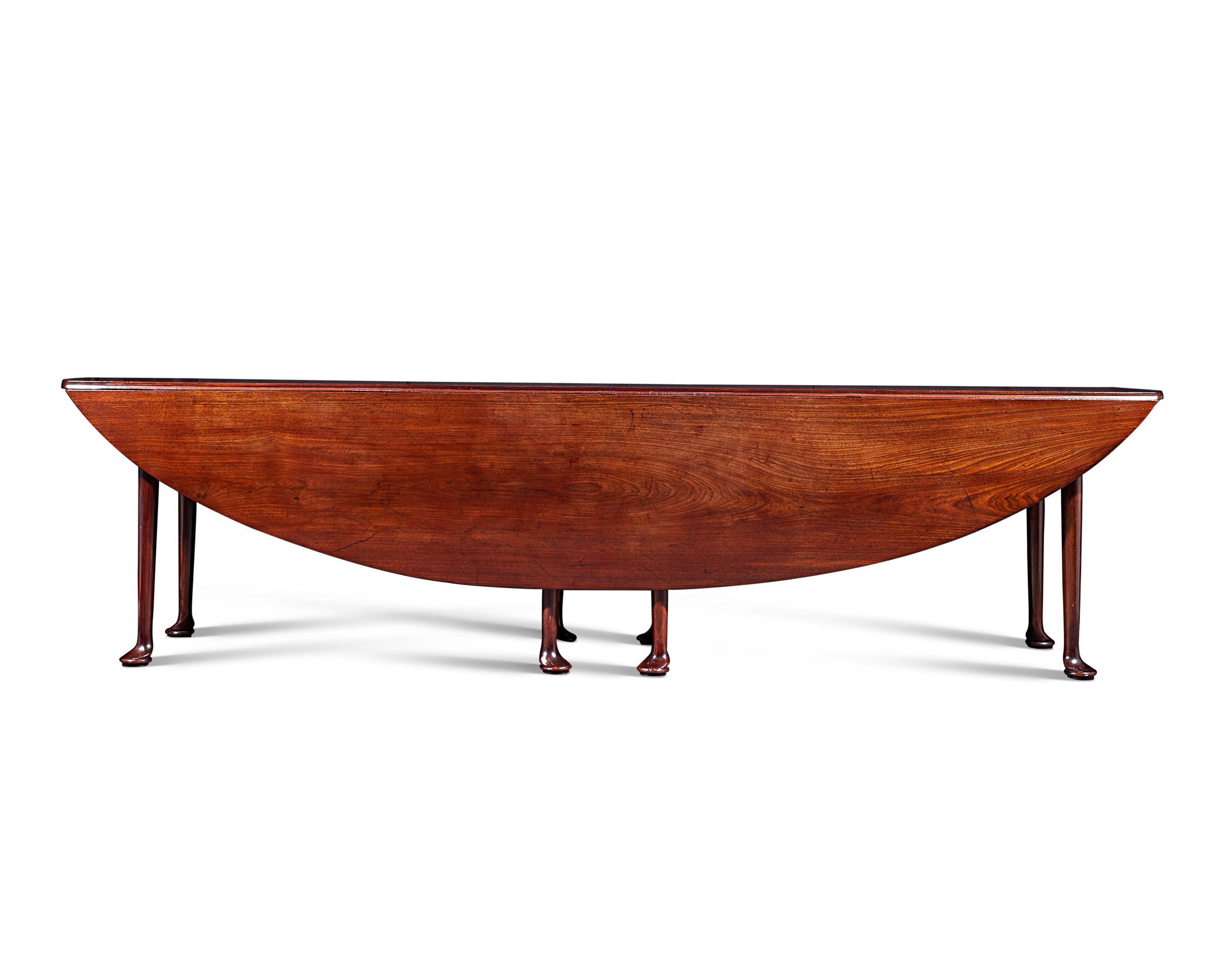 Both outstanding design and rich tradition set apart this intriguing Irish George III-period mahogany table. Often referred to as a “wake” table, this extra-long oval table would have once been used year-round as a dining table. Yet, it also would