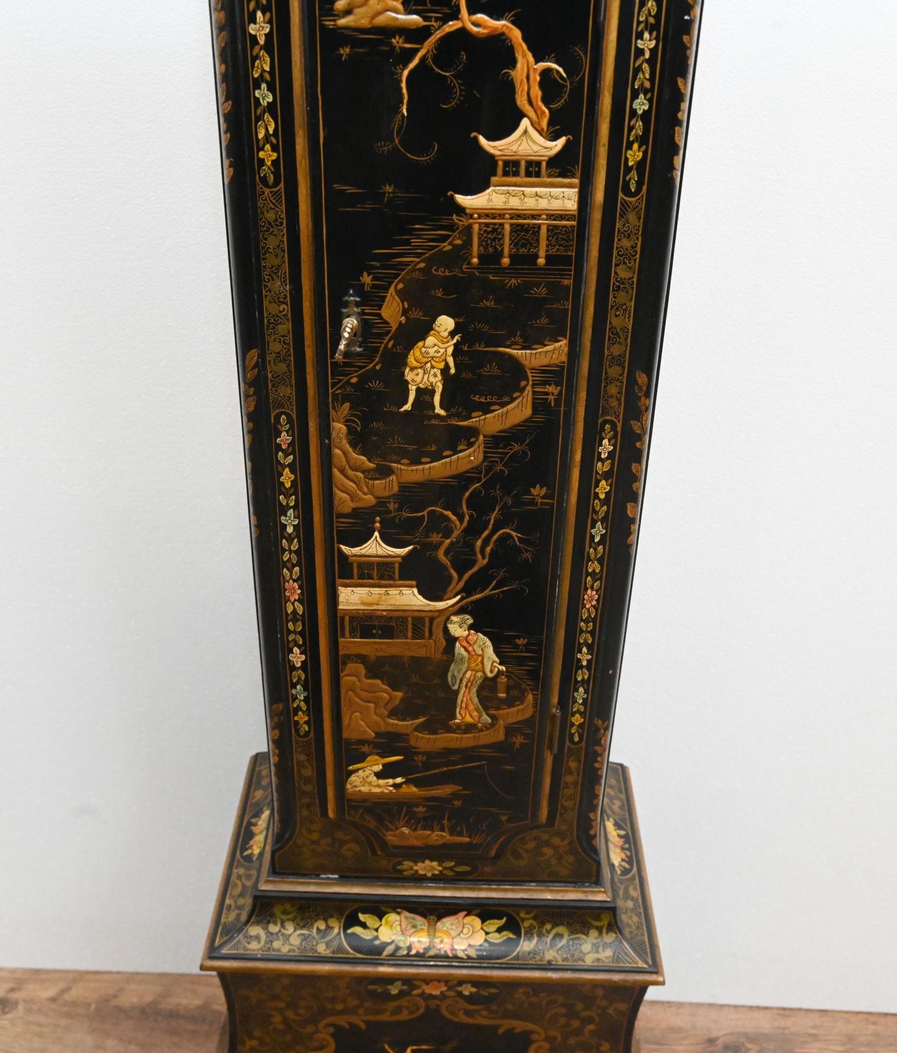 You are viewing a gorgeous lacquered grandfather clock in the George III manner
Features a profusion of intricate painted Chinoiserie on all surfaces
Chinoiserie includes Chinese scenes and characters
The movement with a chiming and hourly
