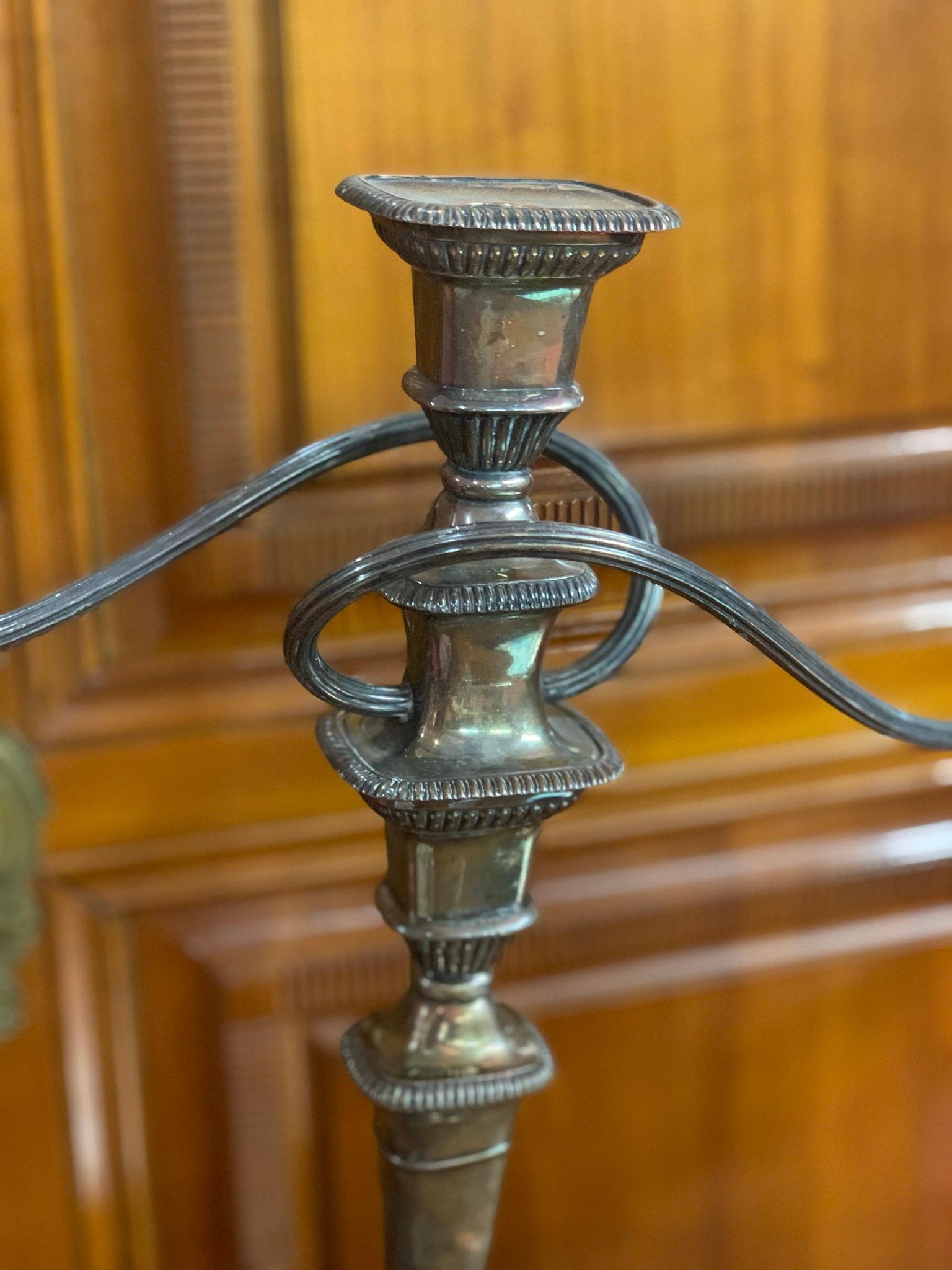 An excellent quality of antique silver candelabra with elegant classical styling. Plain clean lines with fluted tapering columns and bead borders.