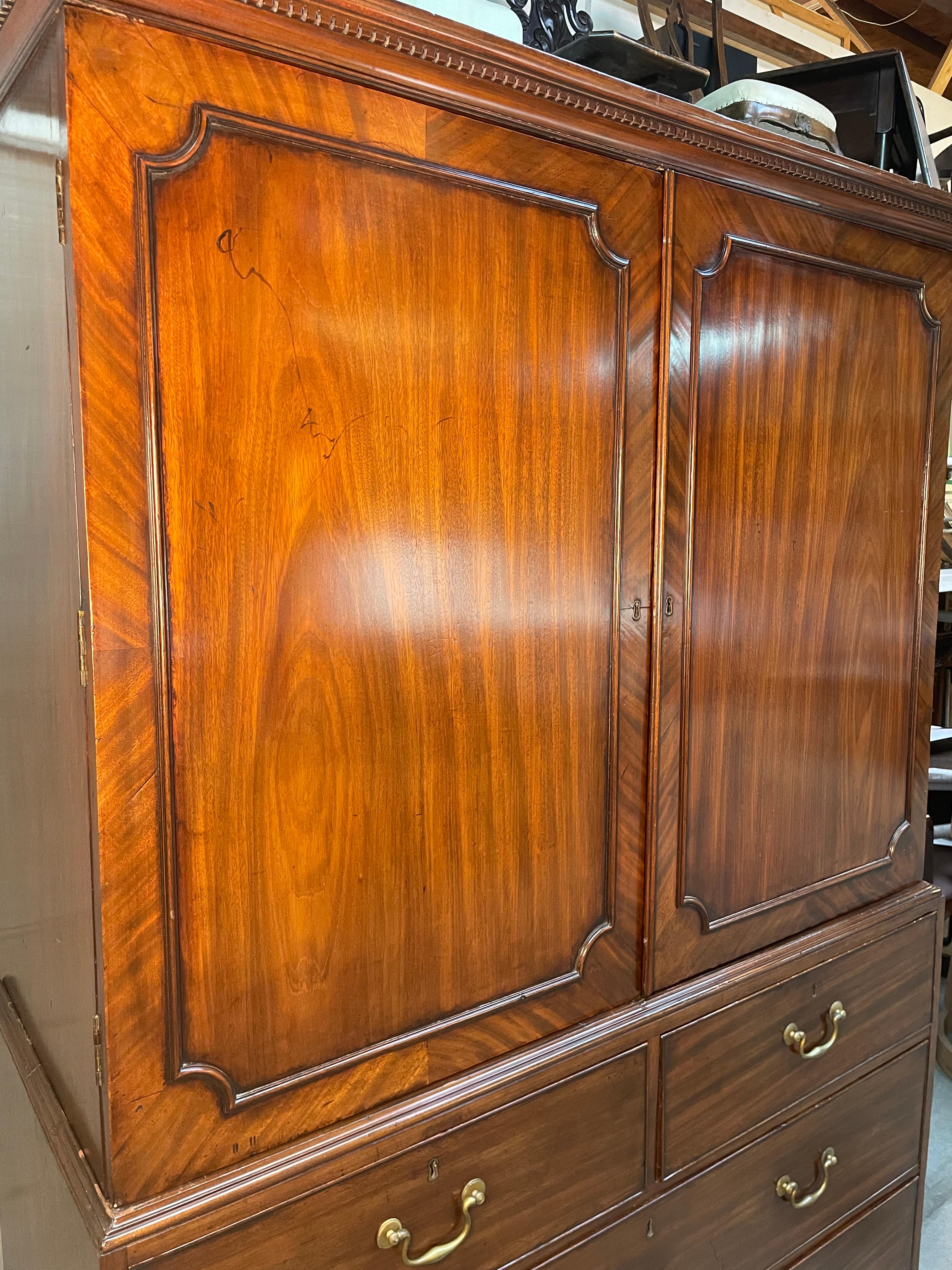 Made with strong mahogany wood in the Mid-18th century in England, this linen cabinet is of the most desirable. Extremely fine proportions of the linen press of the wardrobe, which would have been expected from any piece during this period. The