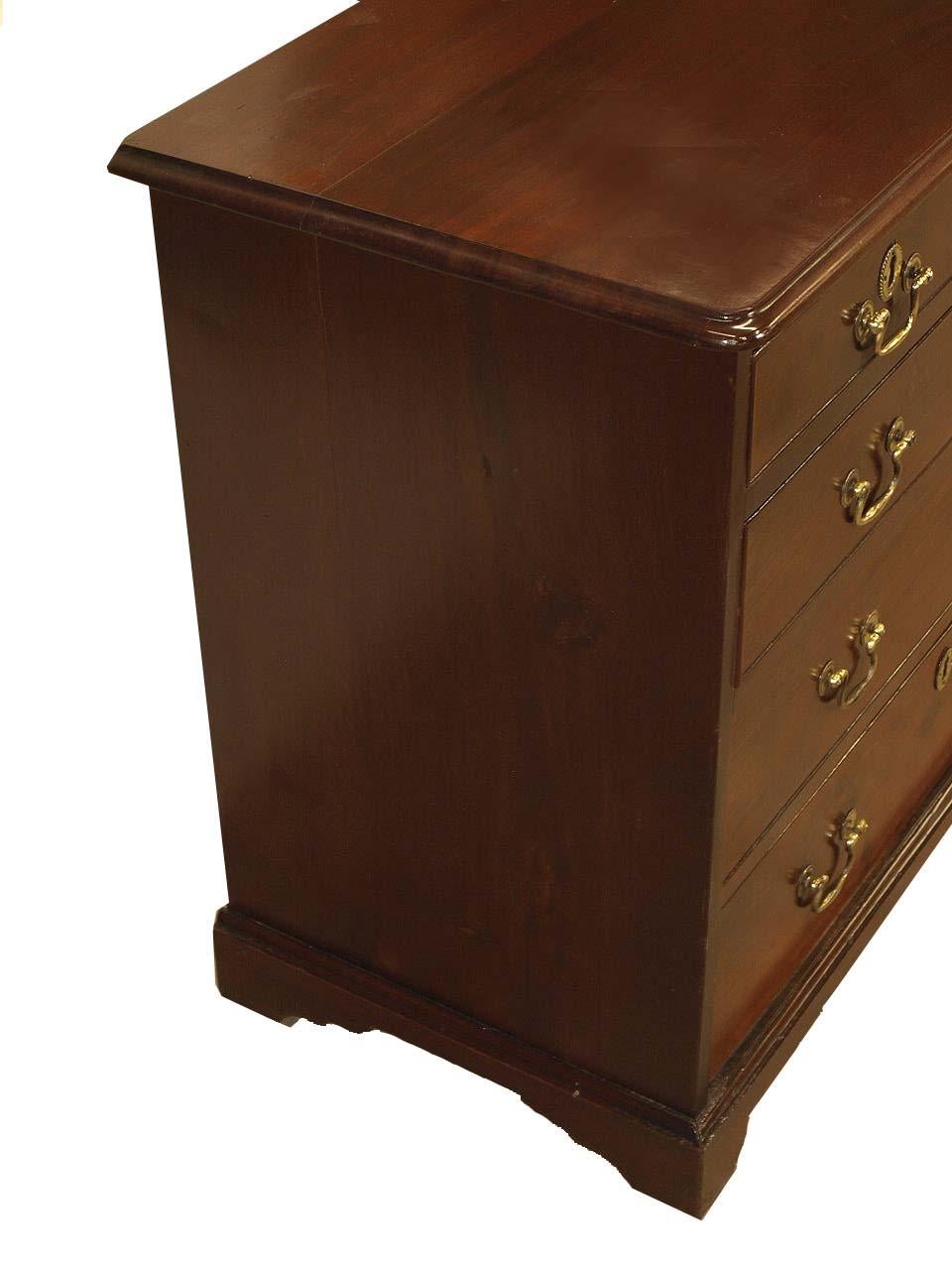 George III bachelor's chest, the two over three drawers with original brass swan neck pulls and escutcheons and original petite bracket feet. This chest is highly desirable for it's size, the 32'' width makes it extremely versatile for most any