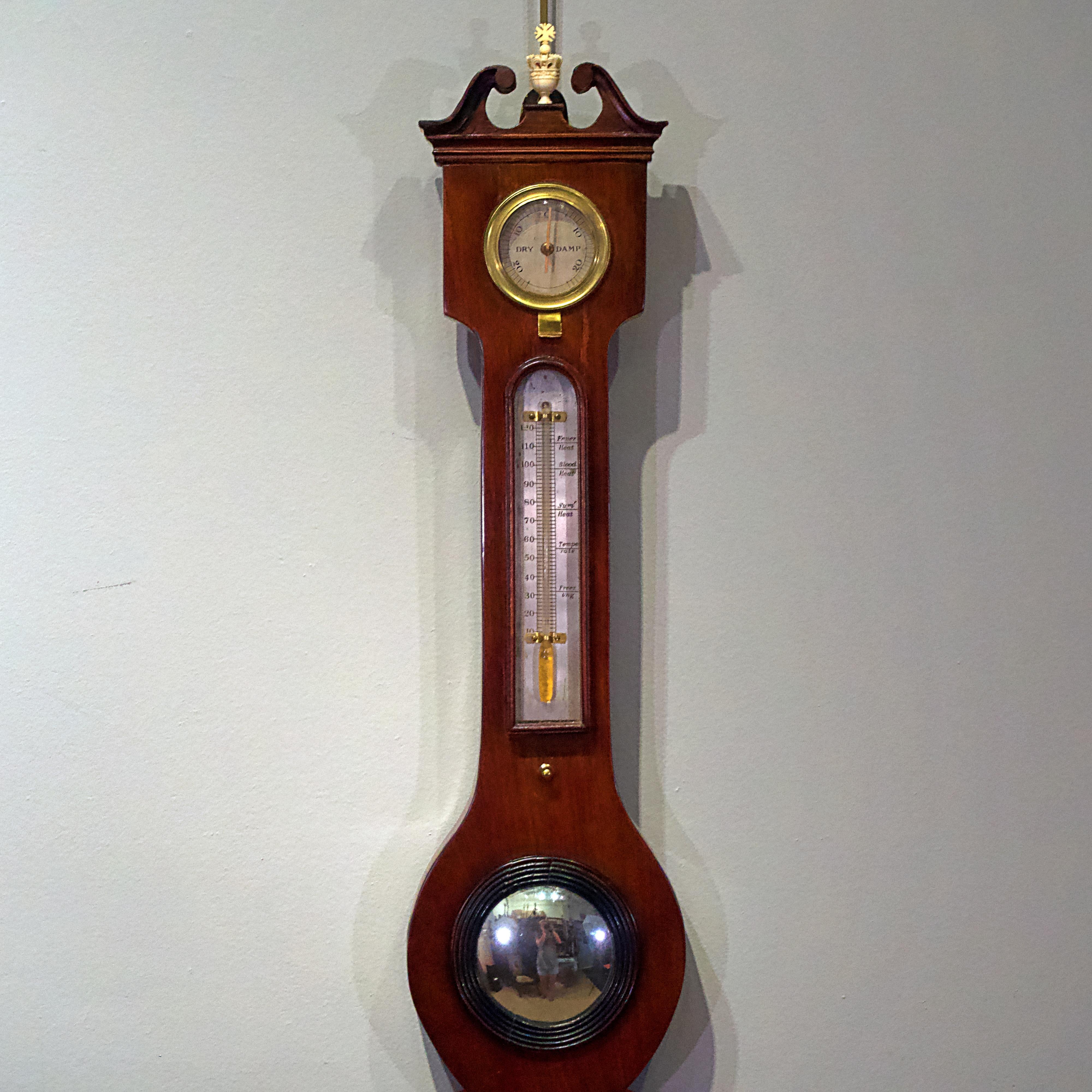 Late 18th century banjo barometer, with thermometer, level, convex plate, bone carved crown finial
Brass bezels and glass.