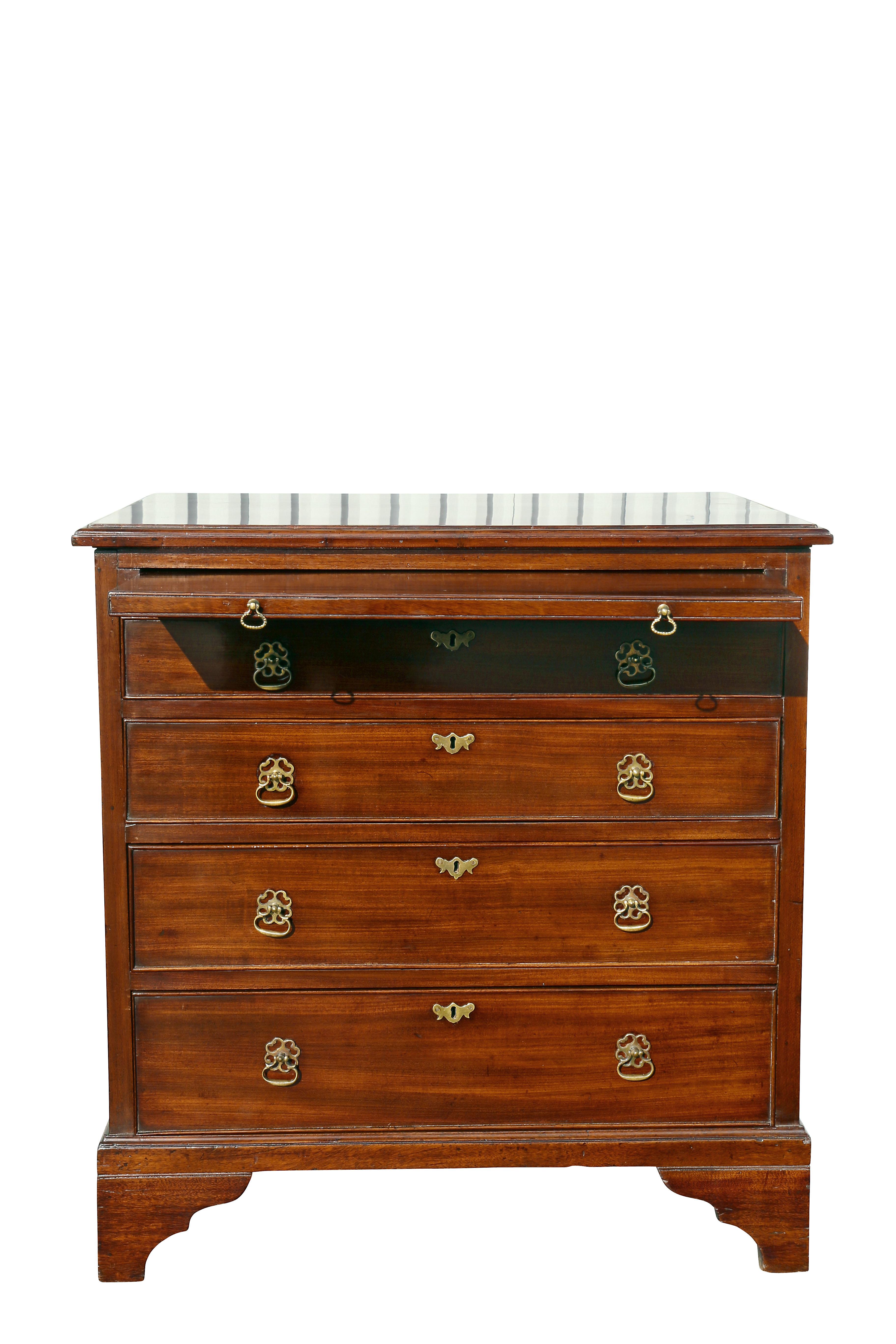 Rectangular top over a brushing slide and four graduated drawers, bracket feet.