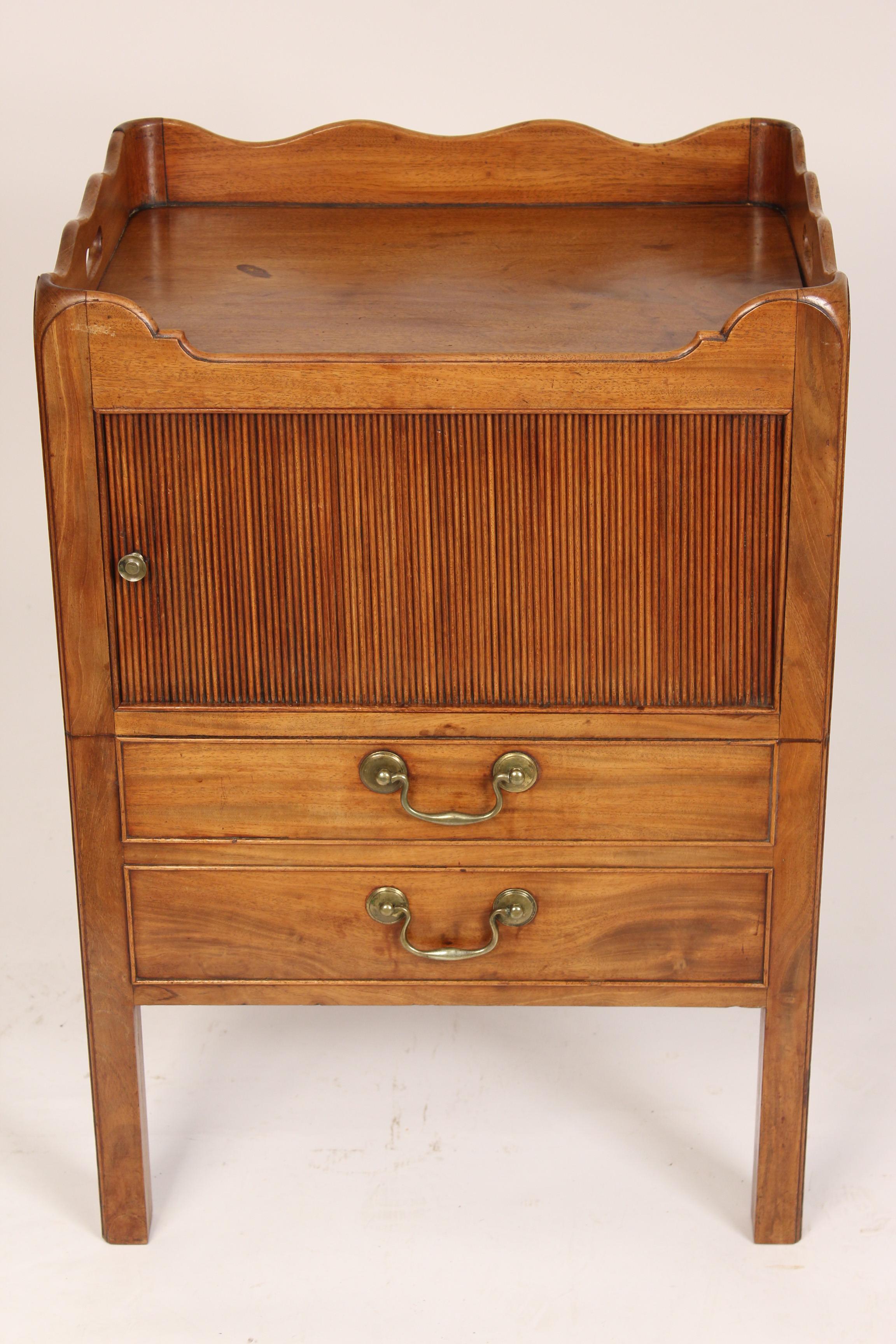 George III mahogany bedside commode with a tambour door, circa 1800. Measure: Overall height 30.25