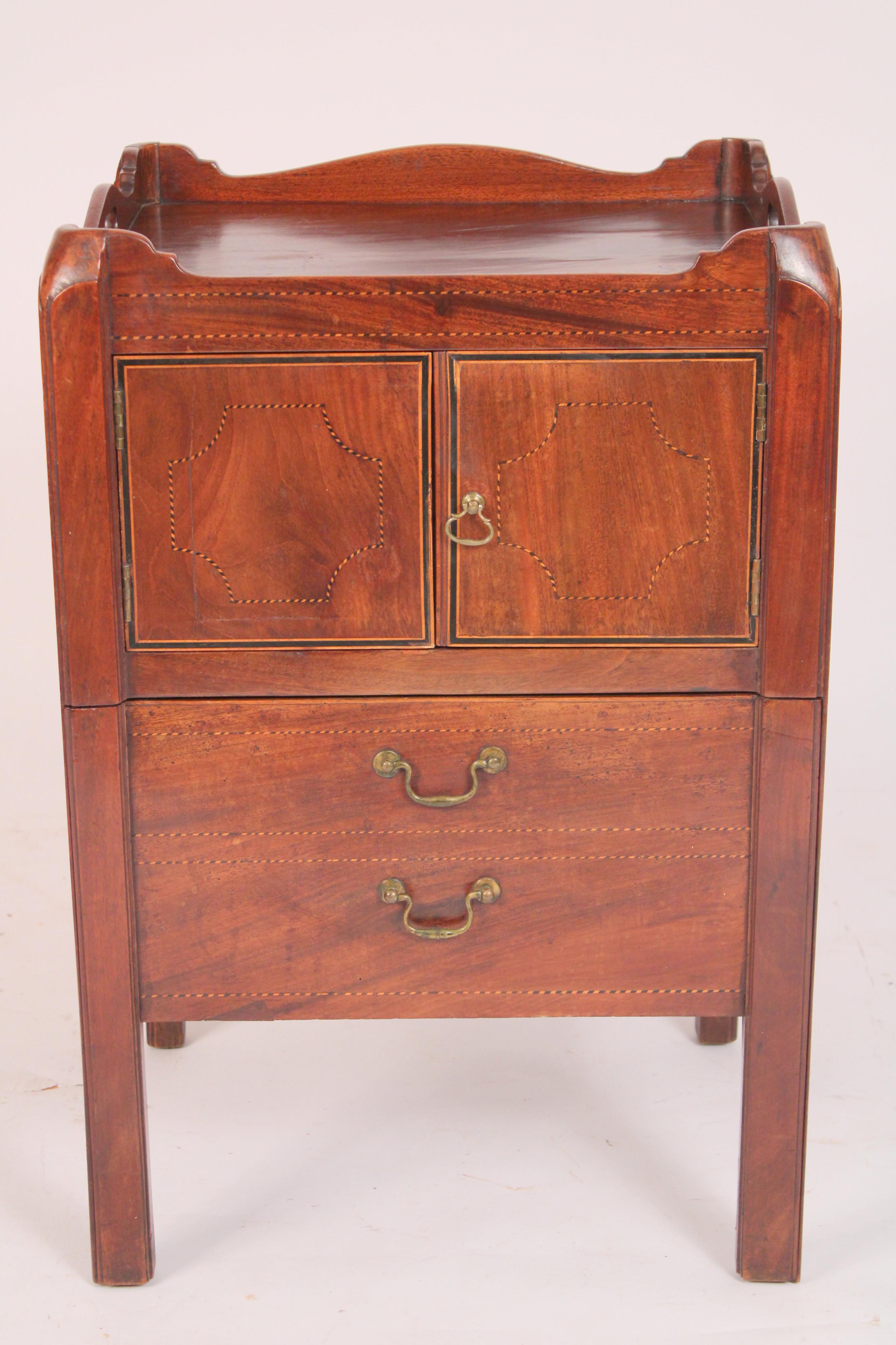 George III mahogany bedside table, circa 1800. With a square top with serpentine shaped side and back gallery, two drawers with string inlaid borders, bottom two false drawers pull out, see photos, resting on square legs.