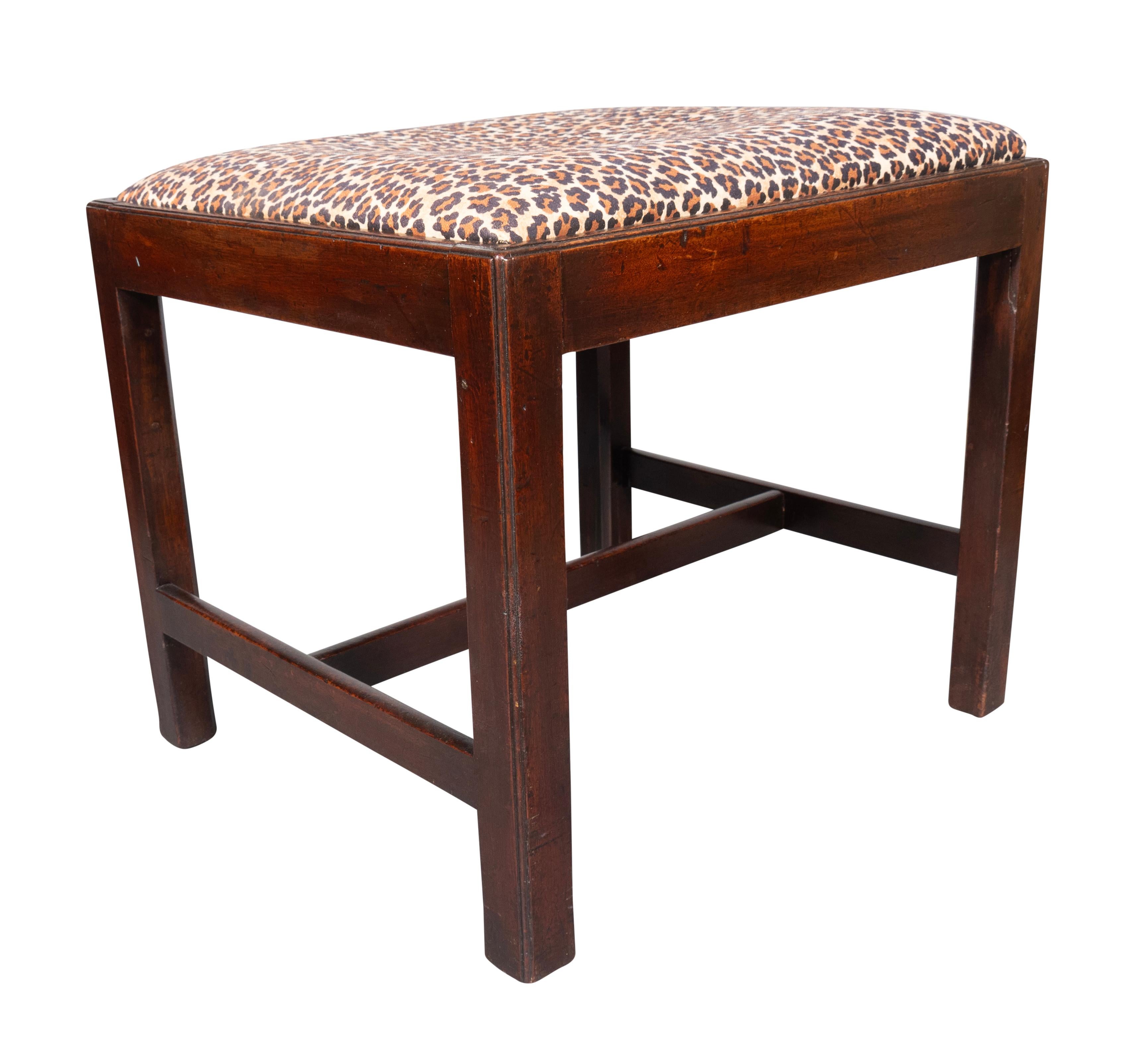 With rectangular but almost square drop in upholstered seat with molded seat frame raised on square section legs.