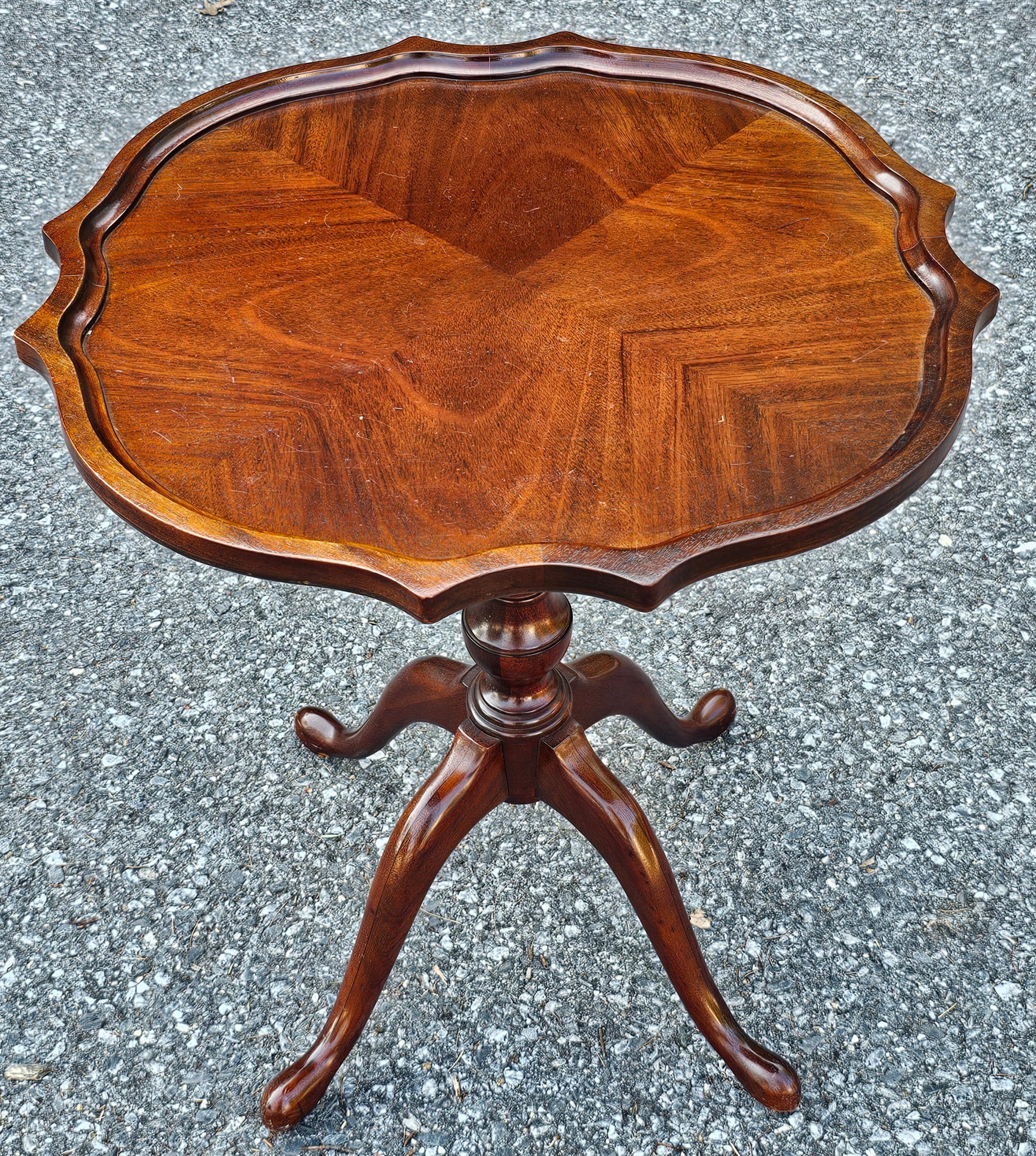 George III Mahogany Bookmatched Pedestal Quad snake feet Tea Table. Measures 24