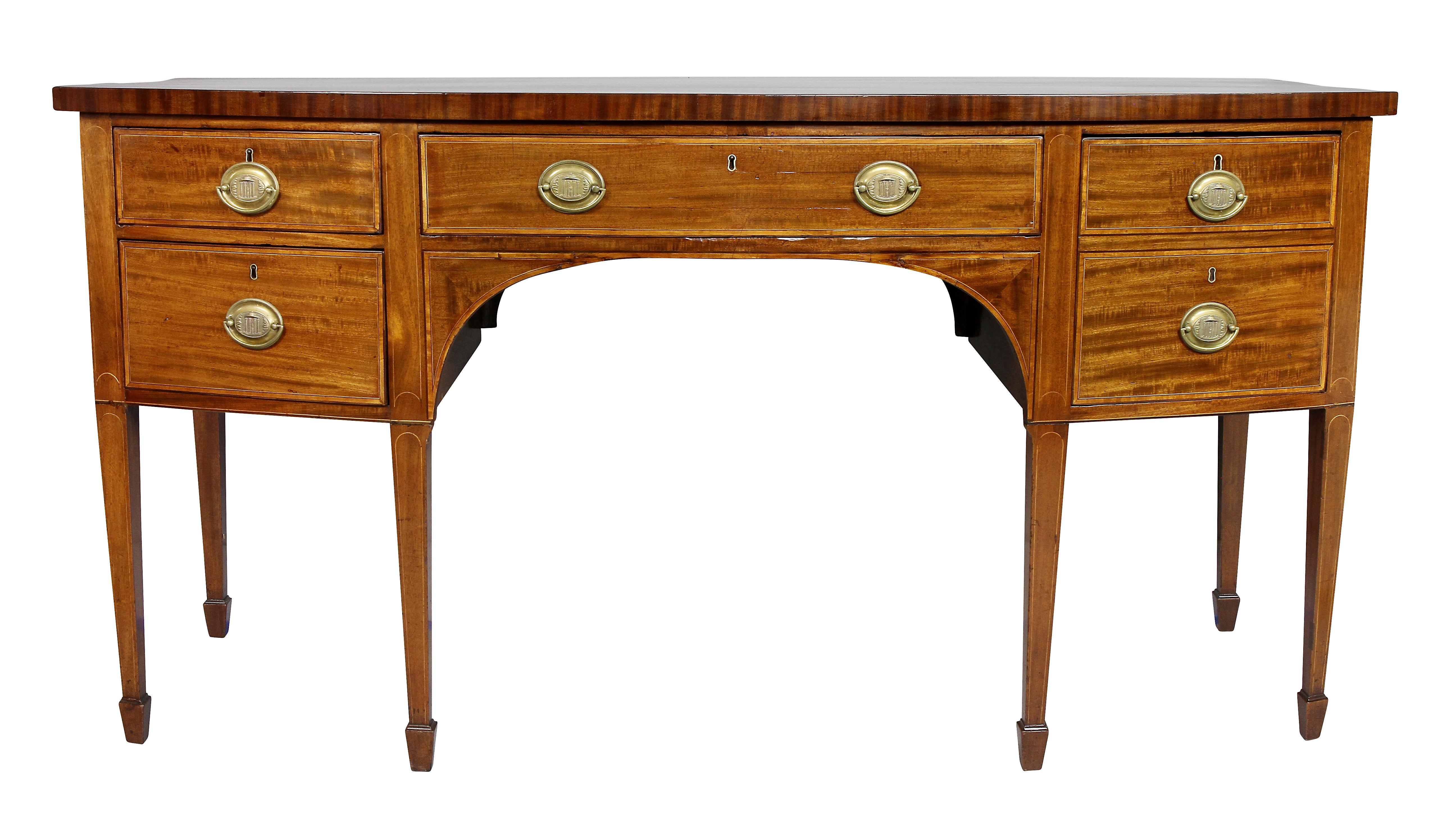 With a bowed rectangular top over a long central drawer flanked on the right by a double drawer and the left two drawers, all cross banded and with oval brass handles, raised on square tapered legs and spade feet.