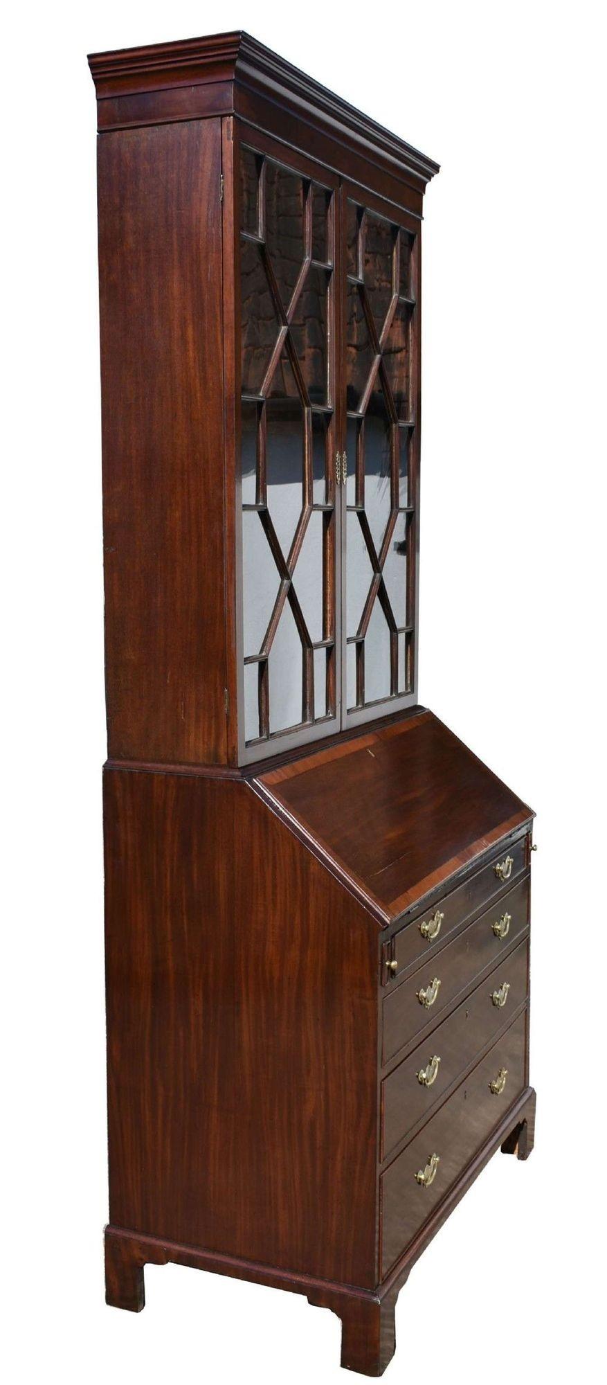For sale is a good quality George III Mahogany Bureau Bookcase. Having two glazed doors in the top, both opening to reveal adjustable shelves. Below this is the bureau section, with a fall front, opening to display a fully fitted interior consisting