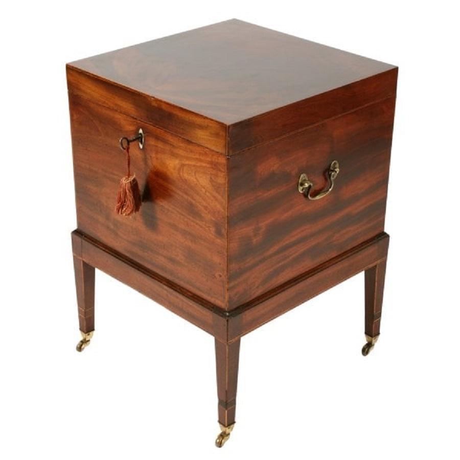 A late 18th to early 19th century Georgian mahogany cellaret.


The cellaret stands on four square tapering legs with brass casters.


The cellaret has a narrow band of inlay to all the edges of the box shaped top with box wood edges to the