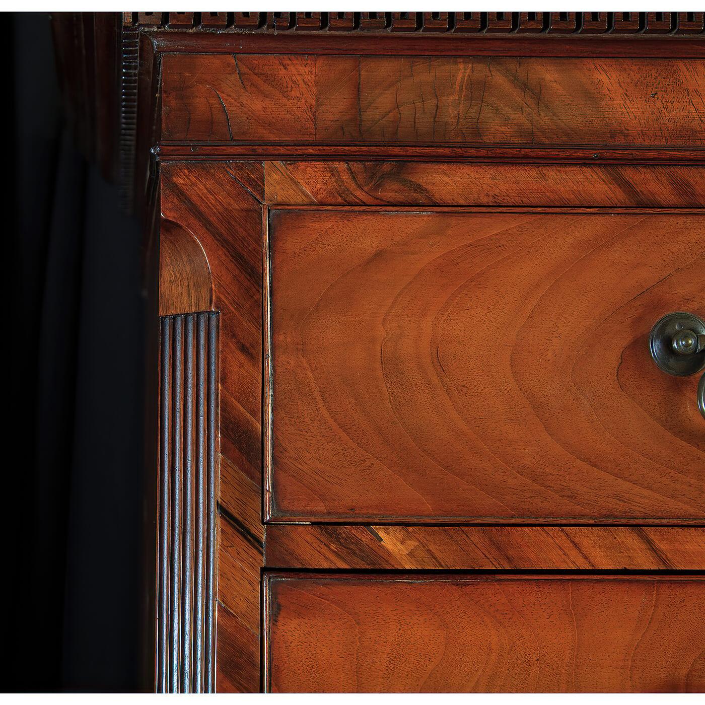 A Fine George II figured mahogany chest on chest with a carved dental molded top cornice, the top section with two split drawers over three graduated drawers, canted and fluted corners above a three graduated drawer lower section also has a brushing