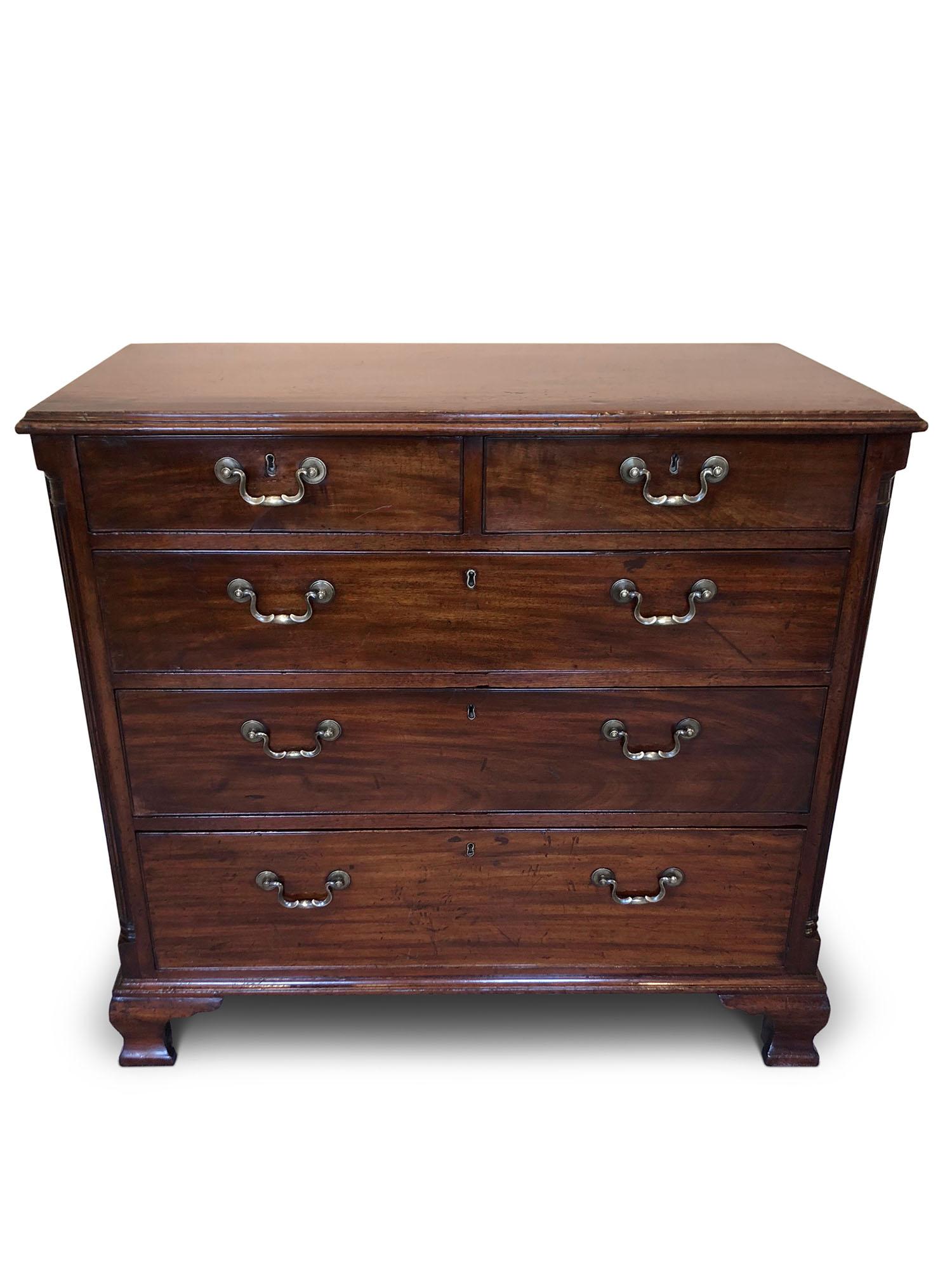 A handsome George III mahogany chest of drawers, circa 1780.
Two small over three long drawers, canted corners with half round fluted columns, standing on Ogee feet.
 