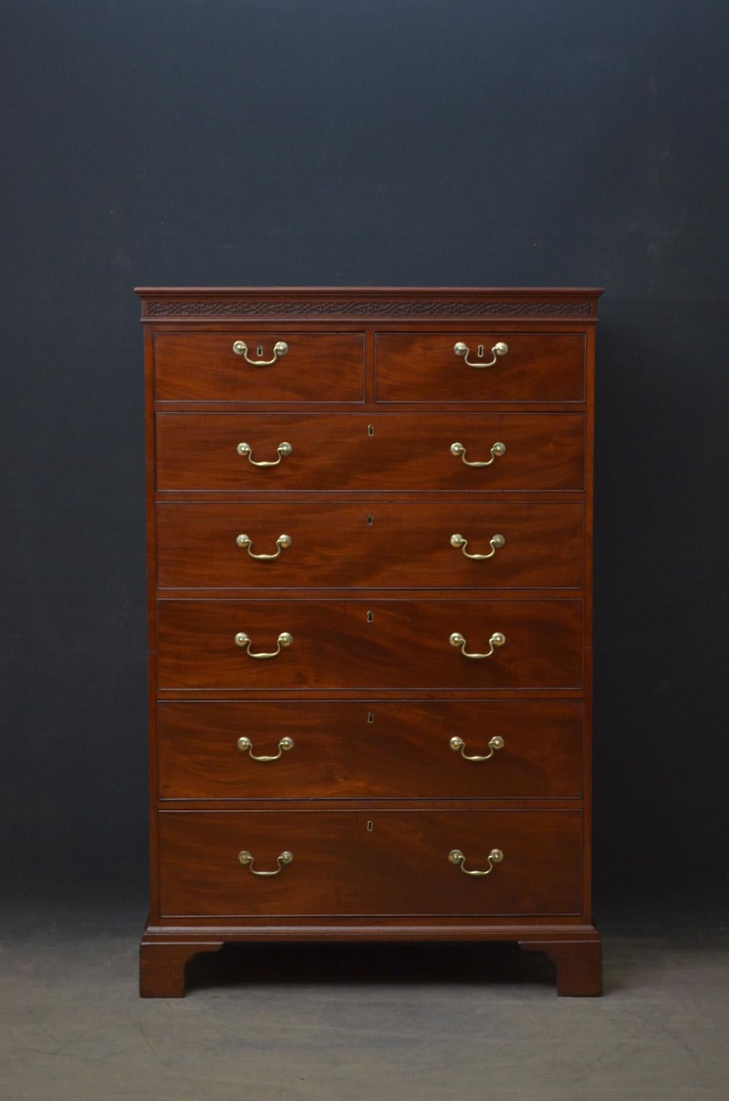 Sn4436, unusual Georgian chest of drawers, having molded cornice above fretwork decoration to frieze and 2 short over 5 long, cockbeaded and oak lined drawers, all fitted with original bras handles and standing on bracket feet. This antique chest