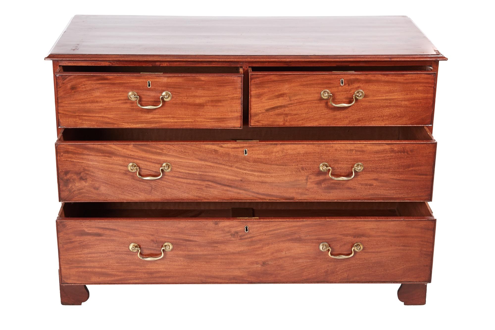 George III mahogany chest of drawers, with a lovely solid mahogany top, two short and two long all with original brass swan-neck handles, standing on original bracket feet
Lovely color and condition.
Measures: 50