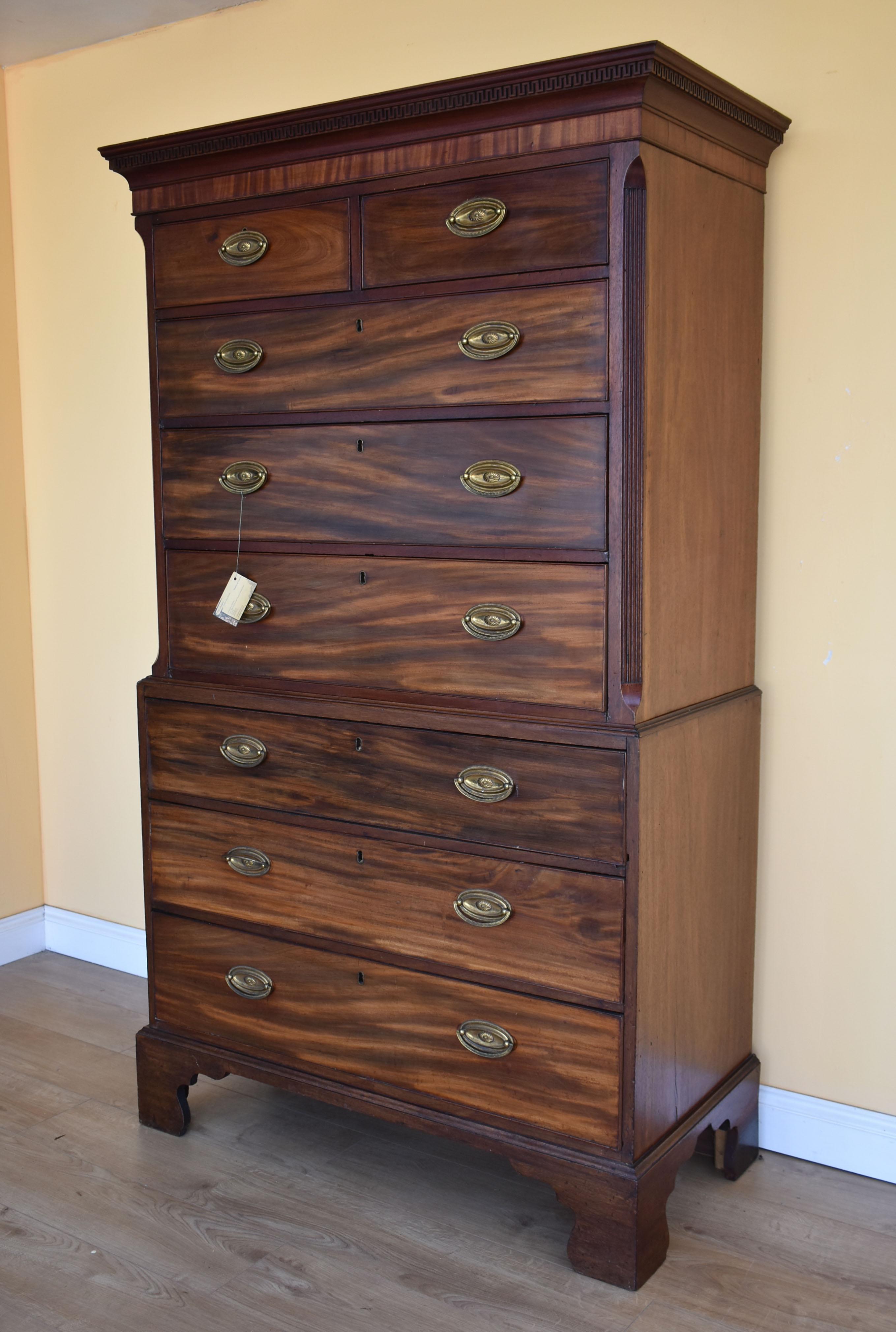 For sale is a good quality, George III Mahogany chest on chest, having a dentil moulded cornice, above four graduated drawers, each with brass plate handles, flanked by canted corners. Below this, the base has a further three drawers, each with