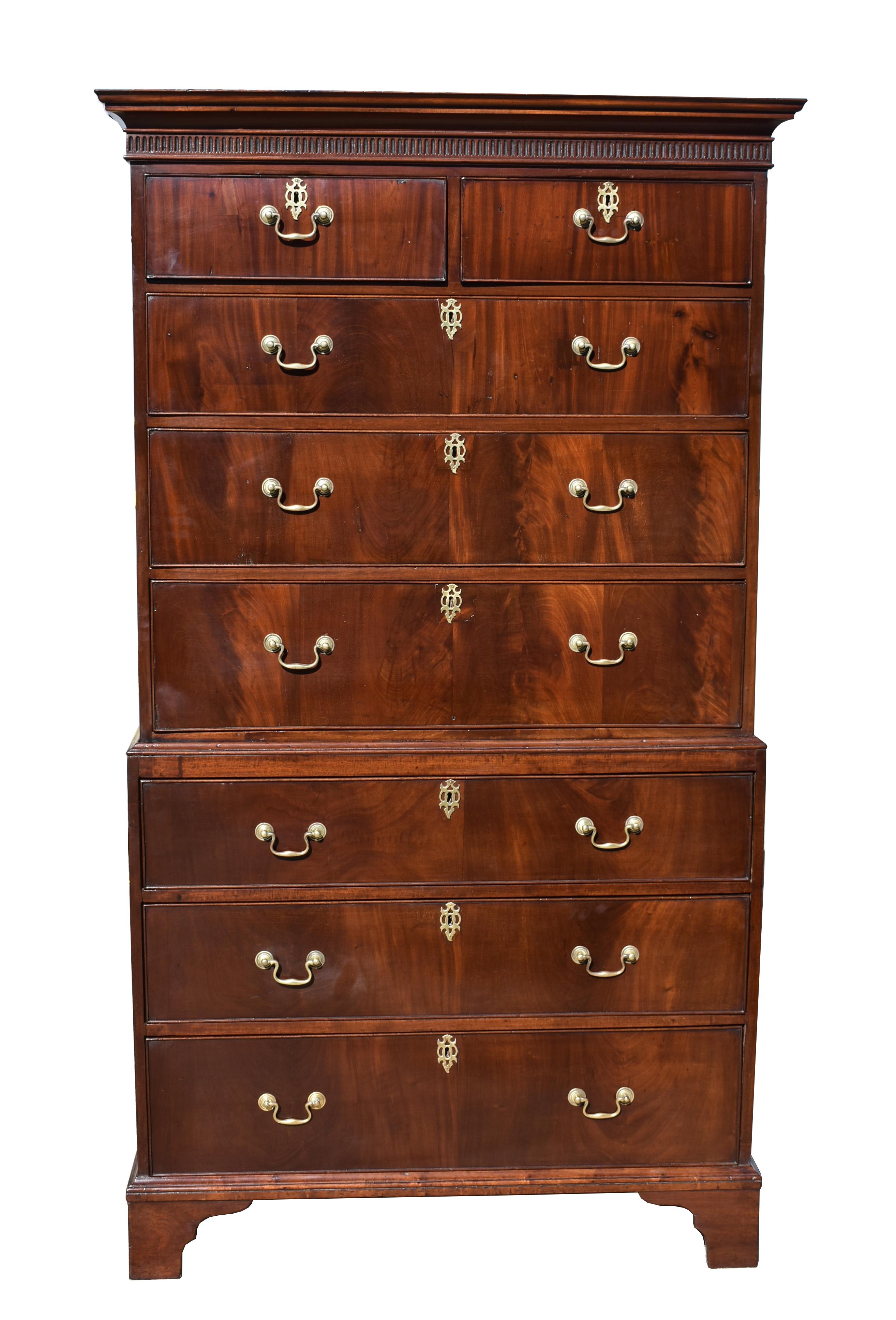 For sale is a good quality George III mahogany chest on chest. The top having two short drawers over three long drawers, each having brass handles and escutcheons. The bottom section has a further three drawers and stands on bracket feet. There are