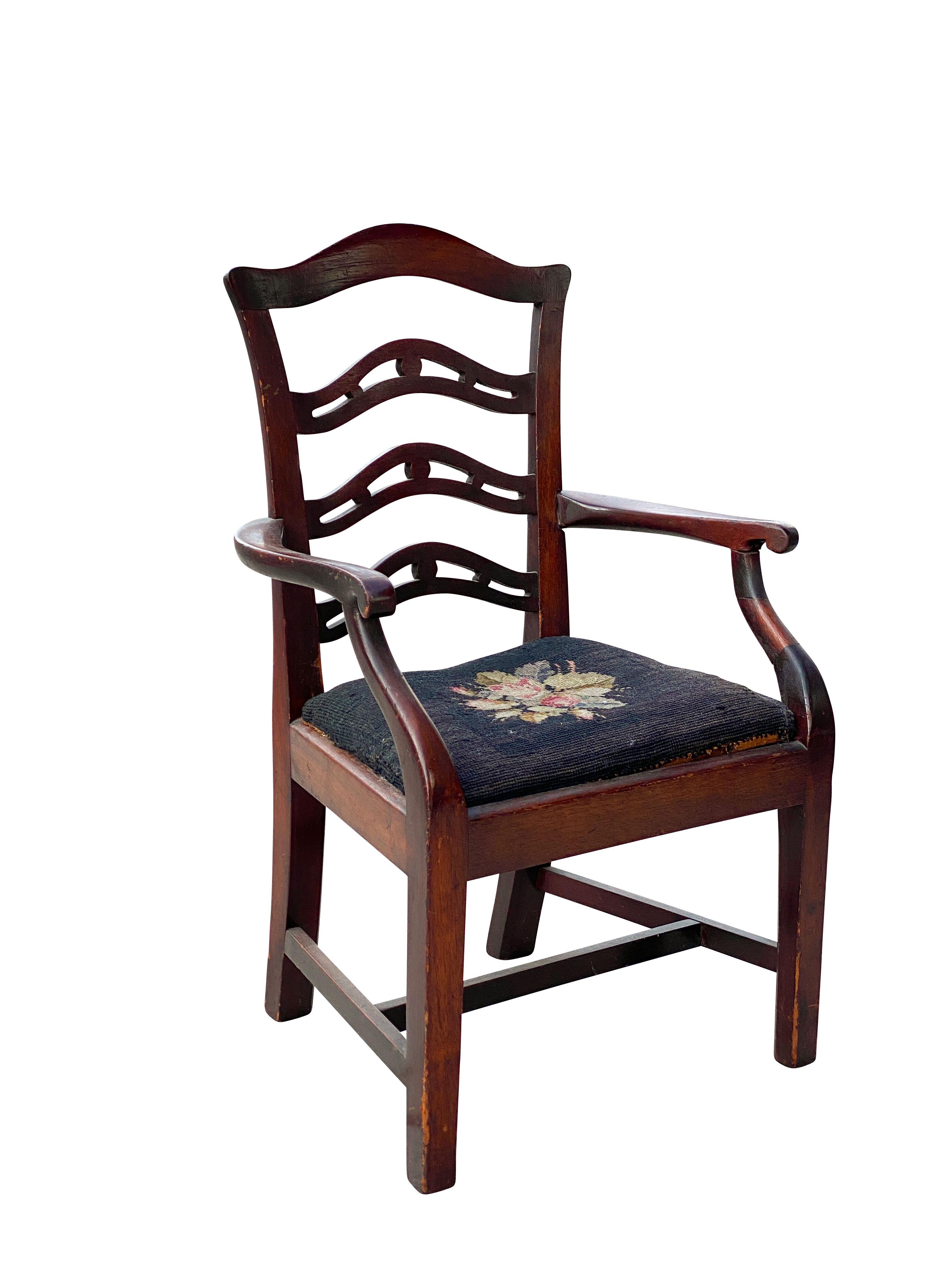 With serpentine crestrail over a pierced ribbon back, drop in seat and straight square legs.