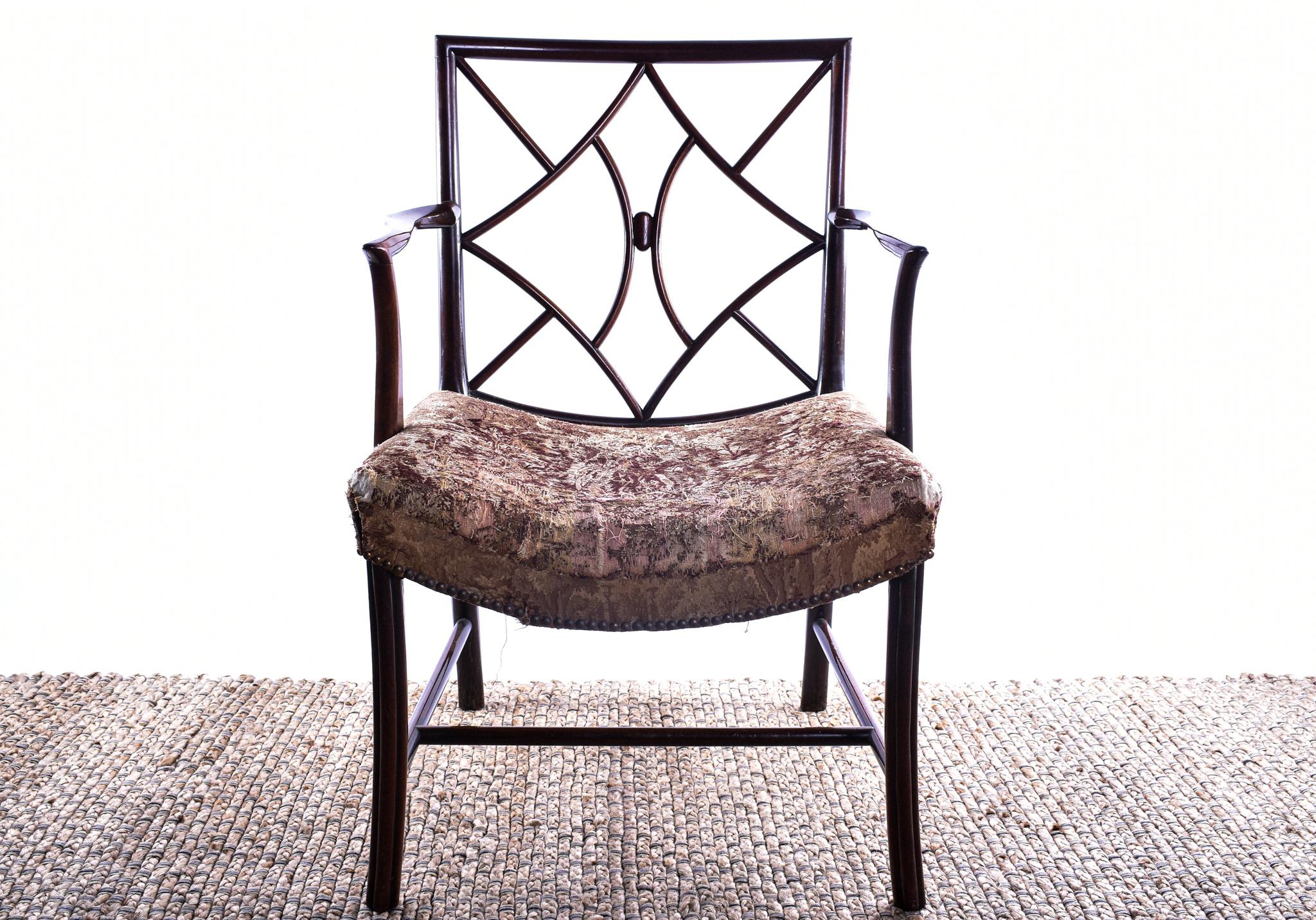 George III mahogany 'Cockpen' Chinese lattice back armchair of broad proportions.

Scottish, c. 1770-1840.

Generously proportioned open armchair, having the square lattice back with unusual ball motif, above the original upholstered saddle seat