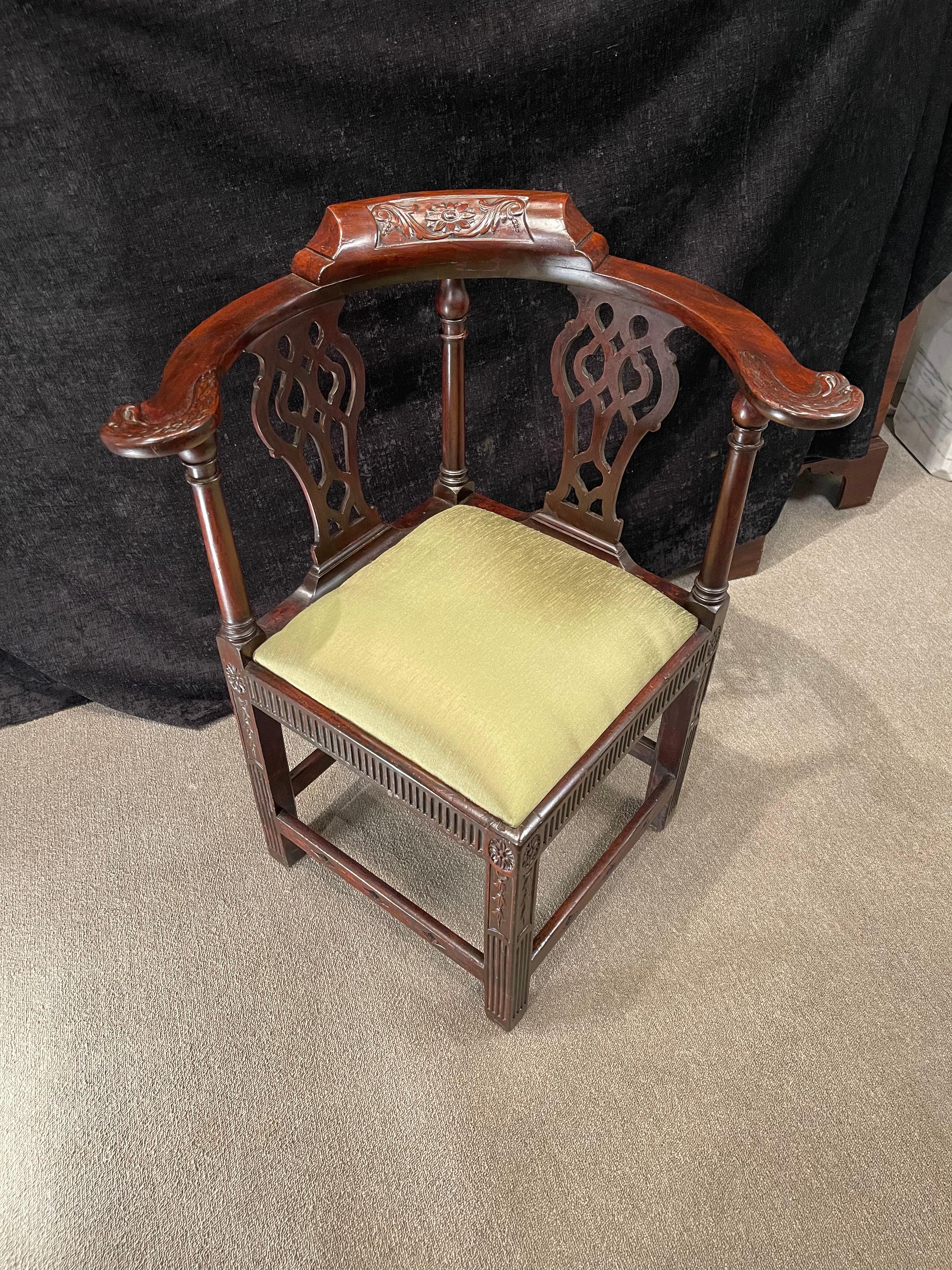 George III Mahogany Corner Armchair, it’s carved backrest & carved eagle form arm rests raised on turned supports with pierced urn form back splats. With green silk slip seat raised on square carved legs.