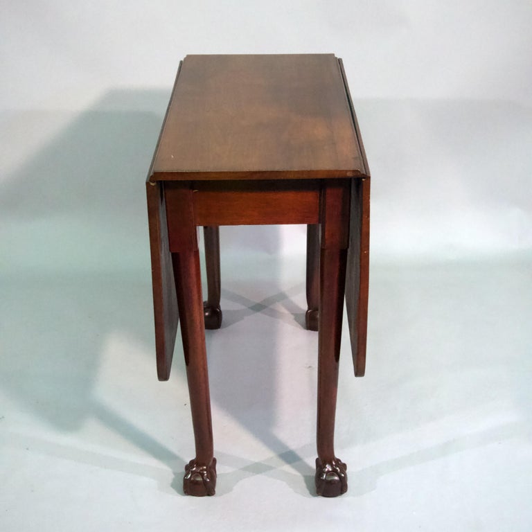 18th century George III mahogany drop leaf gate leg table.
Each leaf supported by a swing leg . Each turned leg terminating 
in a ball and claw feet . fully open top is 48'' X 32''
formerly the property of a Sagaponack, NY collector   