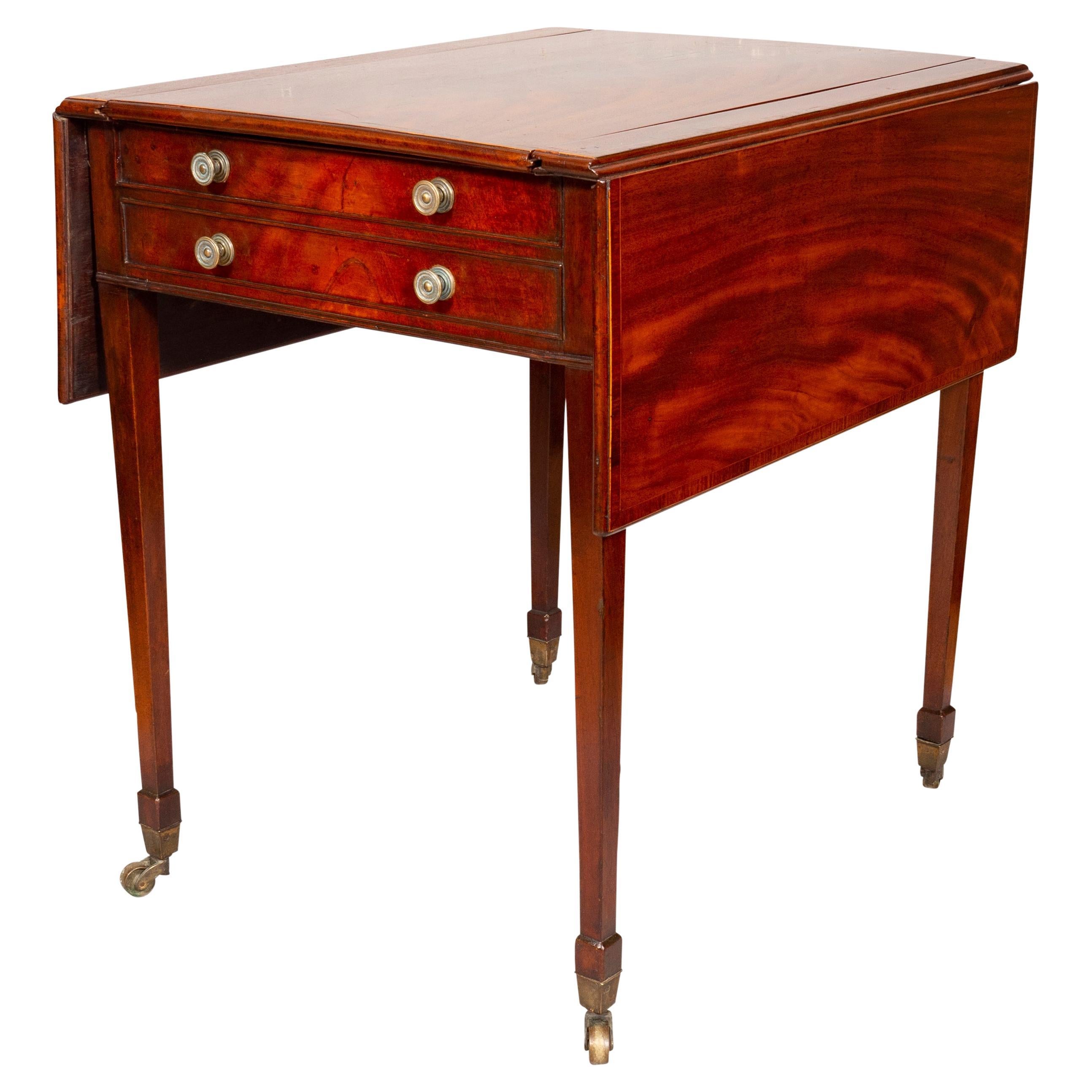 With rectangular top with drop leaves and sliding game board opening to a backgammon surface over a false and working drawers, raised on square tapered legs. Casters.