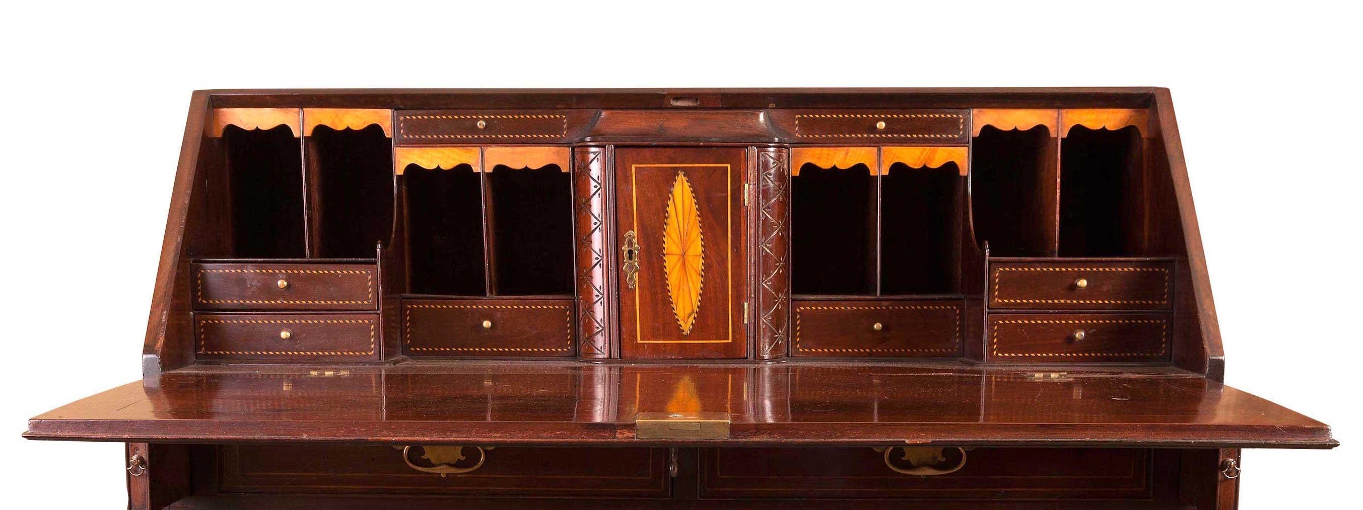 A George III Mahogany Bureau, circa 1770 with nicely fitted interior.
Two small and three large drawers, fall front opening to a very nice fitted interior with Pigeon holes, drawers and central cupboard flanked by secret drawers. Satinwood inlaid