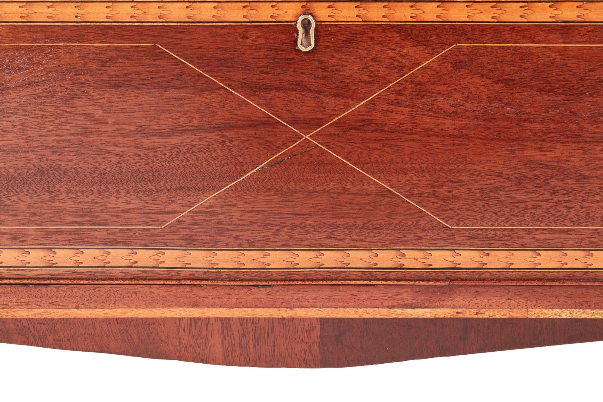 George III mahogany inlaid chest of drawers, having a fantastic original inlaid top with satinwood shells, three long drawers with original satinwood crossbanding and brass handles, standing on bracket feet with a shaped apron
Lovely color and