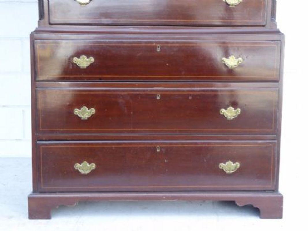 For sale is a good quality George III Country Made mahogany and Inlaid Chest on Chest. The top of the chest a dentil molded cornice, above three small drawers. Below this are a further three drawers, each inlaid and having brass handles. The top