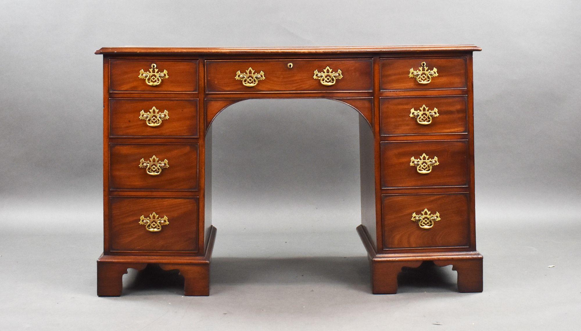 For sale is a good quality George III mahogany kneehole desk, having a well figured top, above an arrangement of nine drawers, each with brass handles, raised on bracket feet, the desk remains in very good condition for its age.

Width: 117cm Depth: