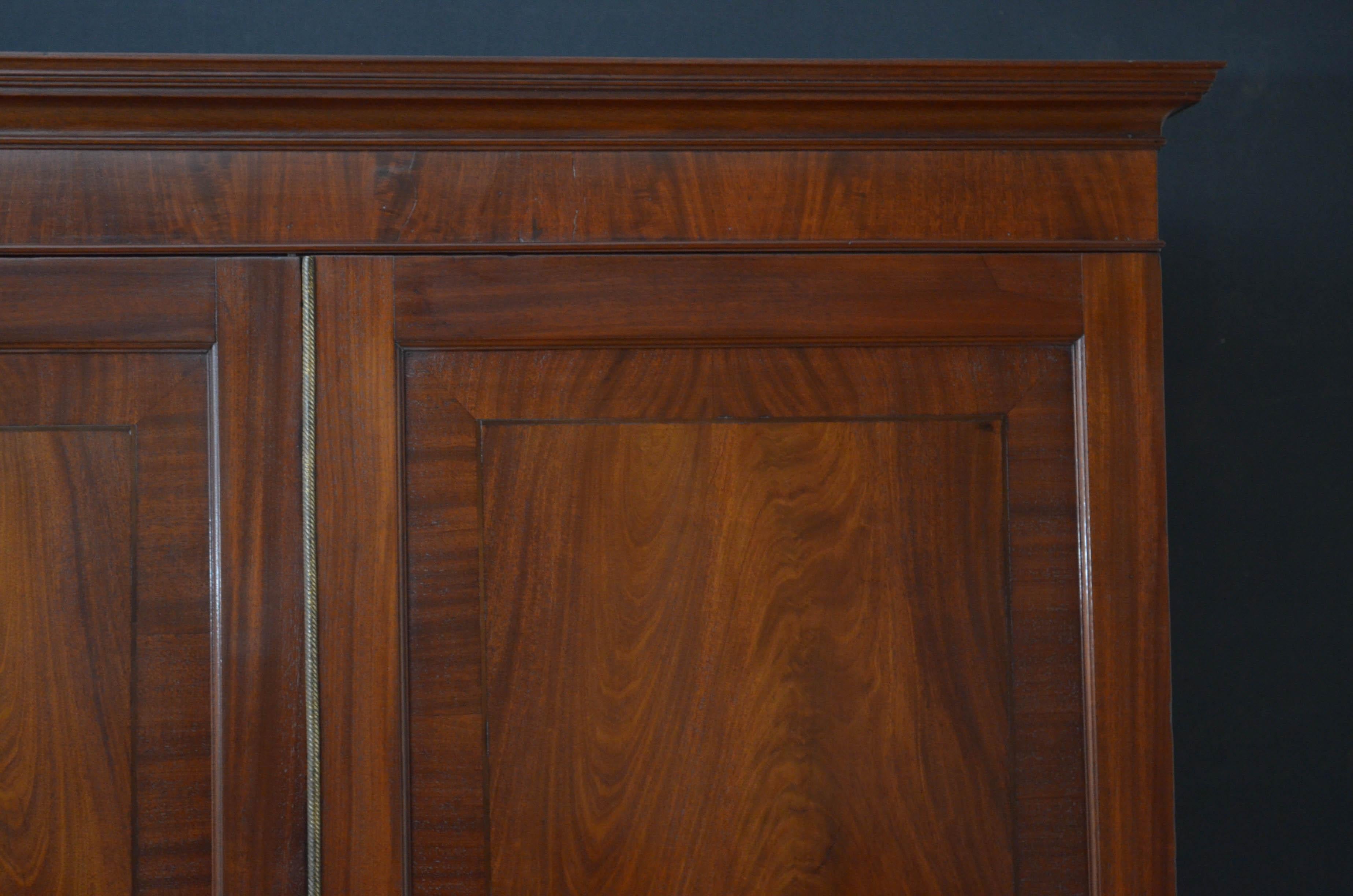 Sn4812 fine quality Georgian linen press in mahogany, having outswept cornice above a pair of string inlaid flamed mahogany doors with original working lock and brass centre bead, the base having 2 short over 2 long cockbeaded and oak lined drawers