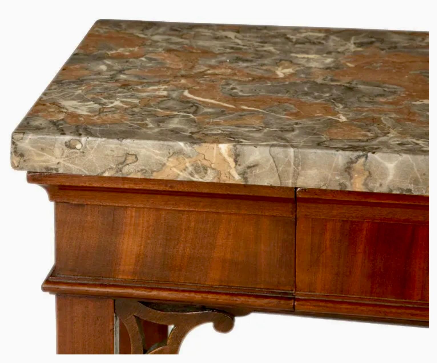 Exceptional circa 1760 Georgian Chippendale mahogany slab or side table with breccia marble top and a single central drawer. 

