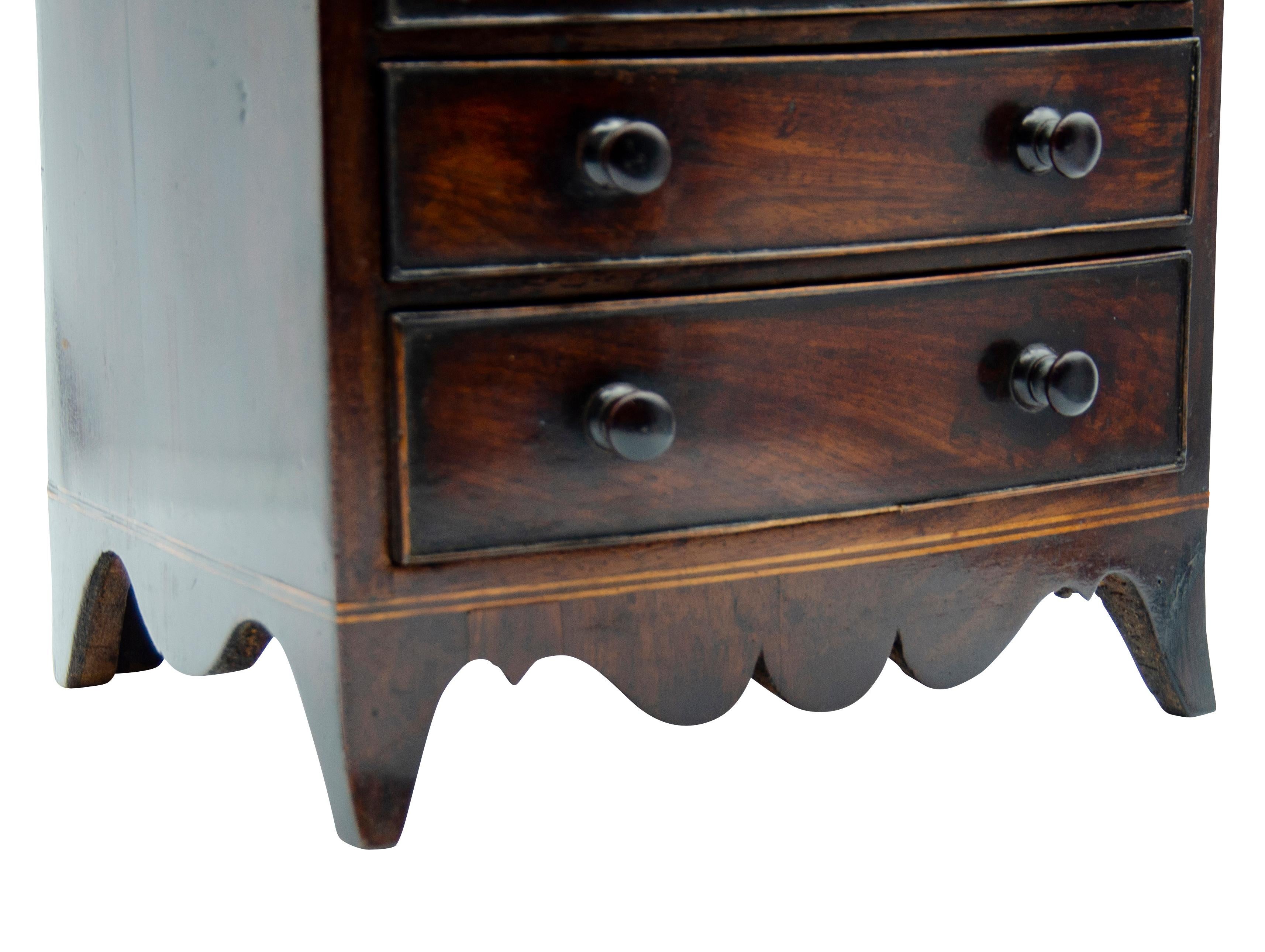 Sweet piece. Bow front with four drawers , spade feet. Turned wood knobs.