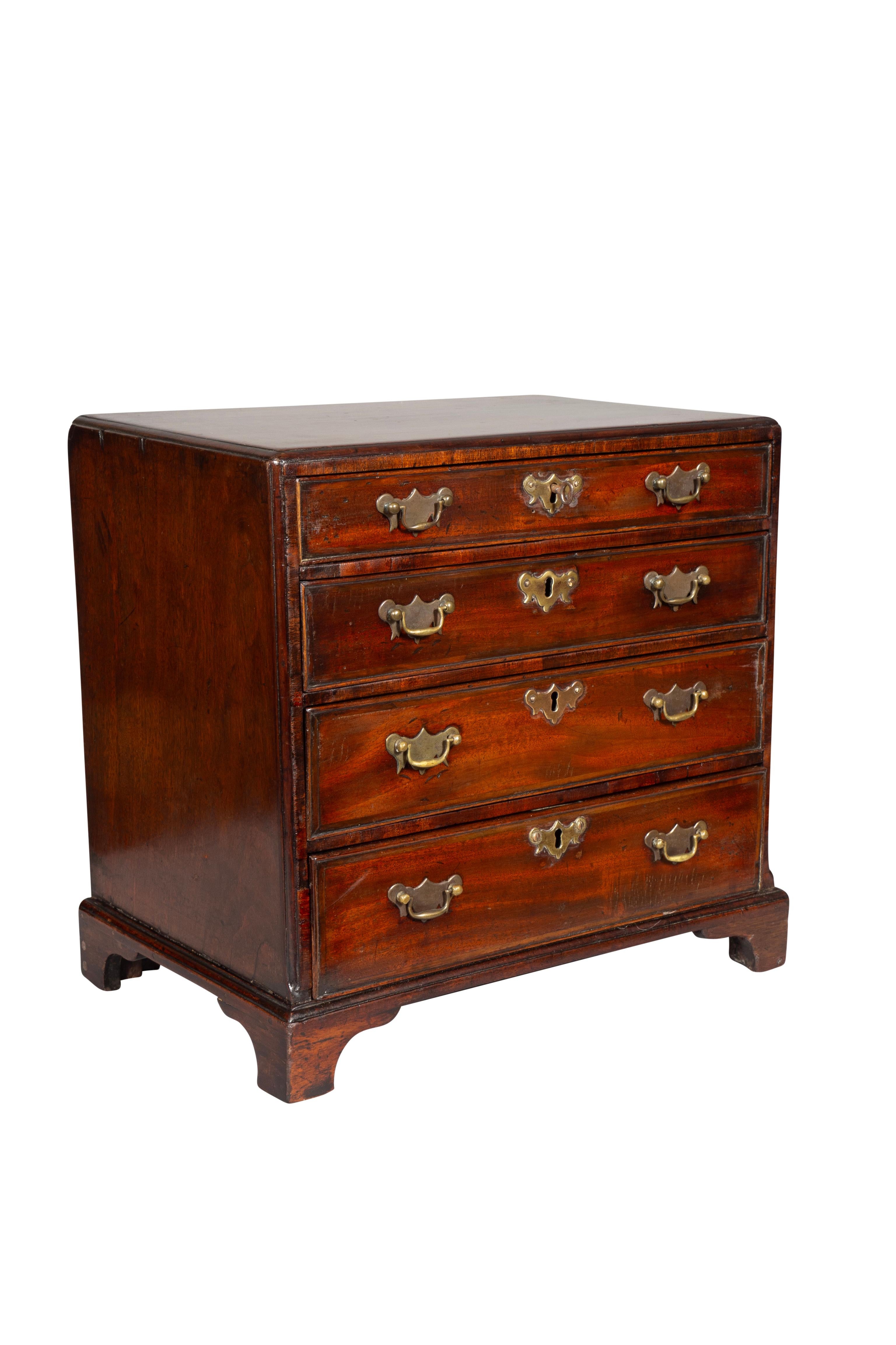 Rectangular with a caddy top over four drawers with bracket feet. These were made by furniture makers for family members and friends. Also used to promote a cabinetmakers skills.