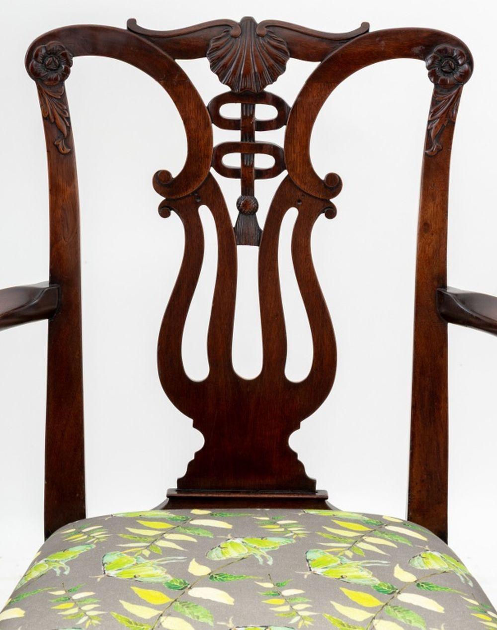 George III Mahogany Open Arm Chair, early 19th century, with scroll top rail and pierced vase-shaped splat carved with shell and rosettes, floral upholstered seat. 37.5
