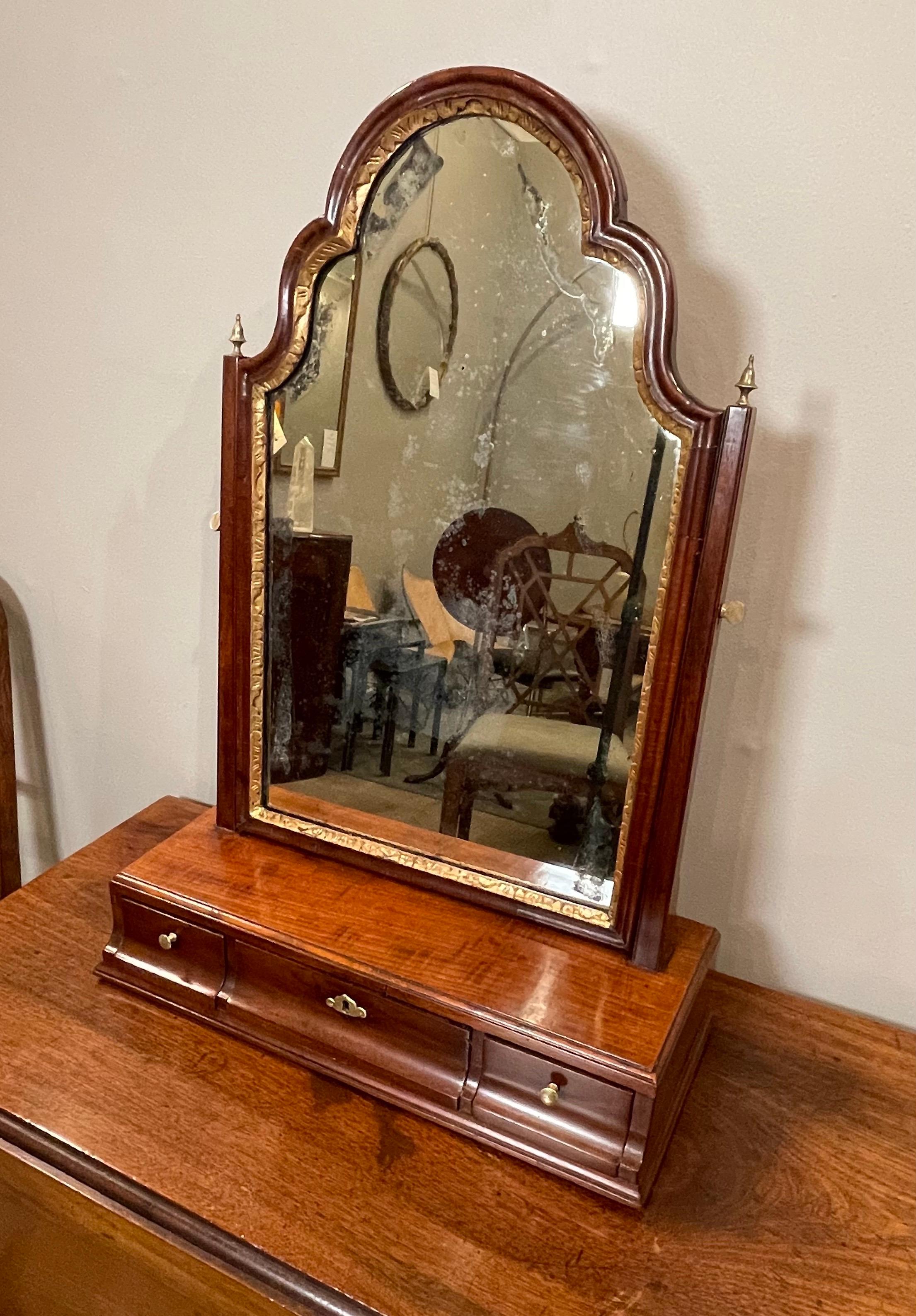 Queen Anne Walnut & parcel gilt toilet mirror with beveled mirror above 3 drawers. 