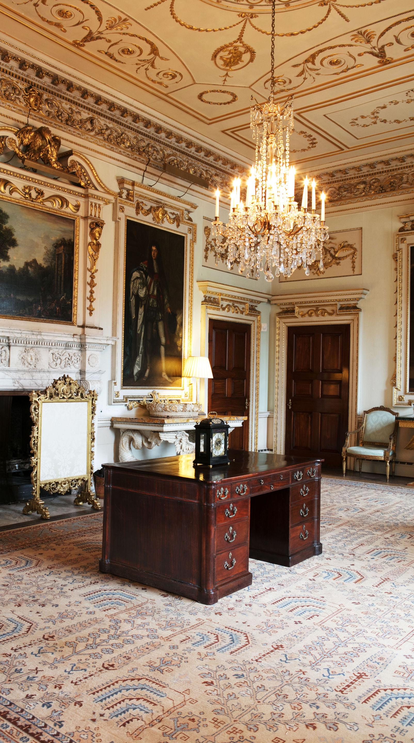 An impressive George III mahogany partners desk. The desk stylistically has strong resemblance to plate LXXXl in 'Chippendales Director'. 

The trefoil corners to the rectangular tooled leather top translate down to the plinth incorporating large