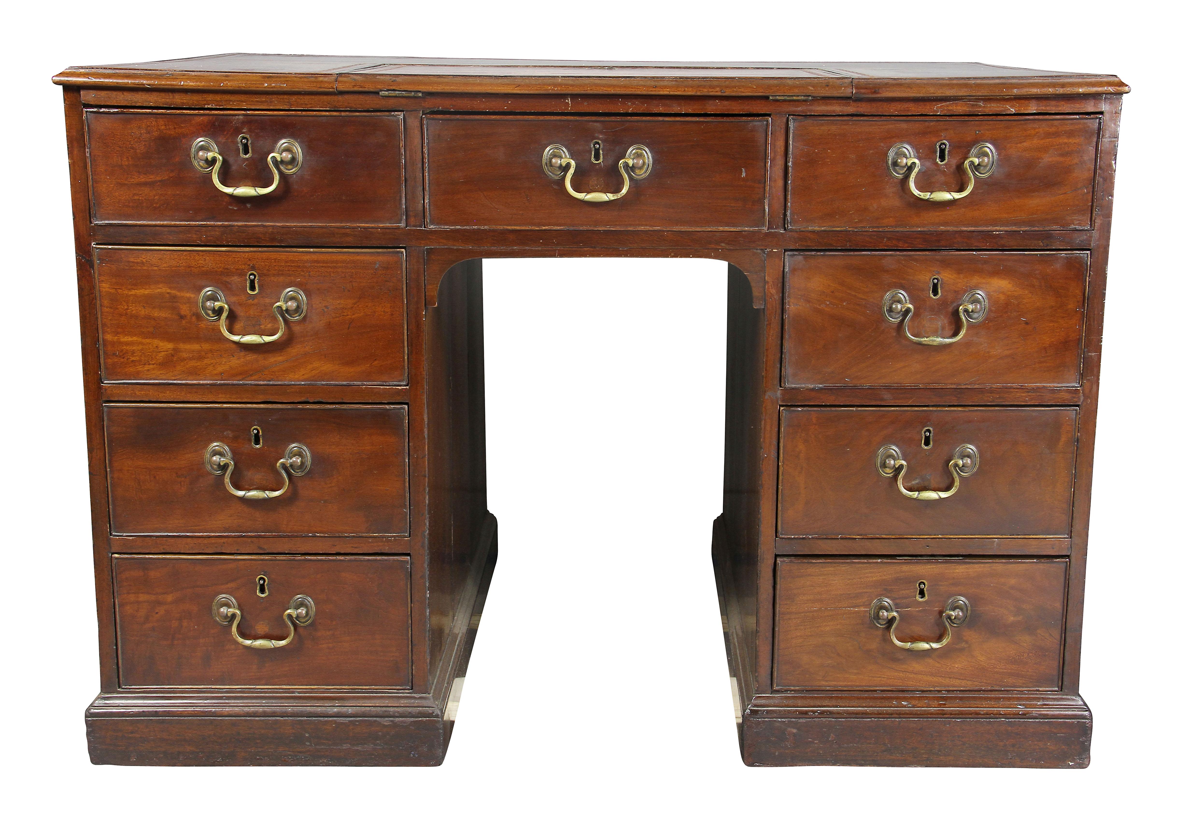 In one piece, with rectangular top with inset red leather top with ratcheted additional writing surface, over three short drawers over two banks of three drawers , the reverse with false matching drawers, side handles, plinth base.