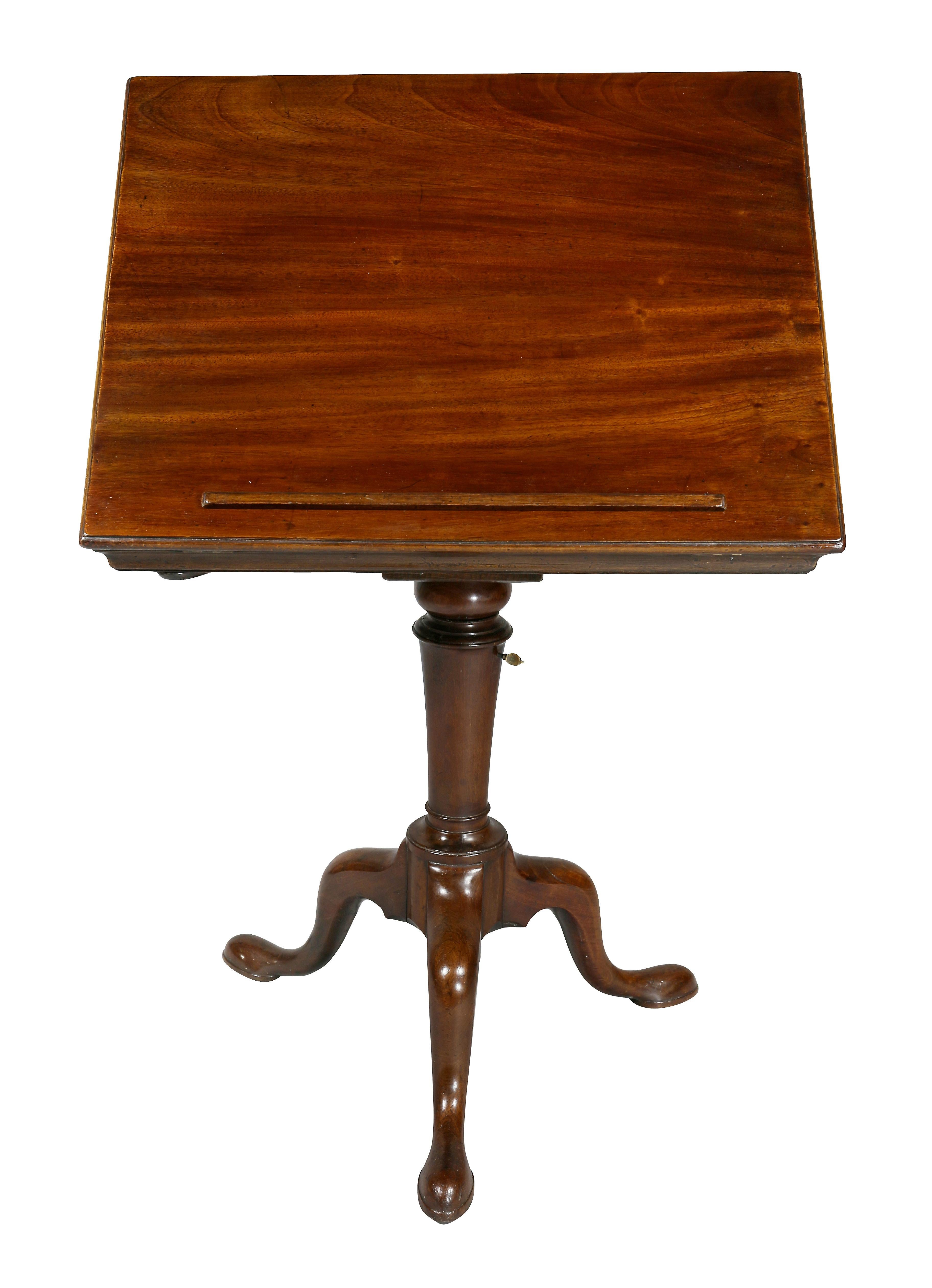 With rectangular hinged adjustable top over a turned support and candleholder, tripartite cabriole legs and pad feet.