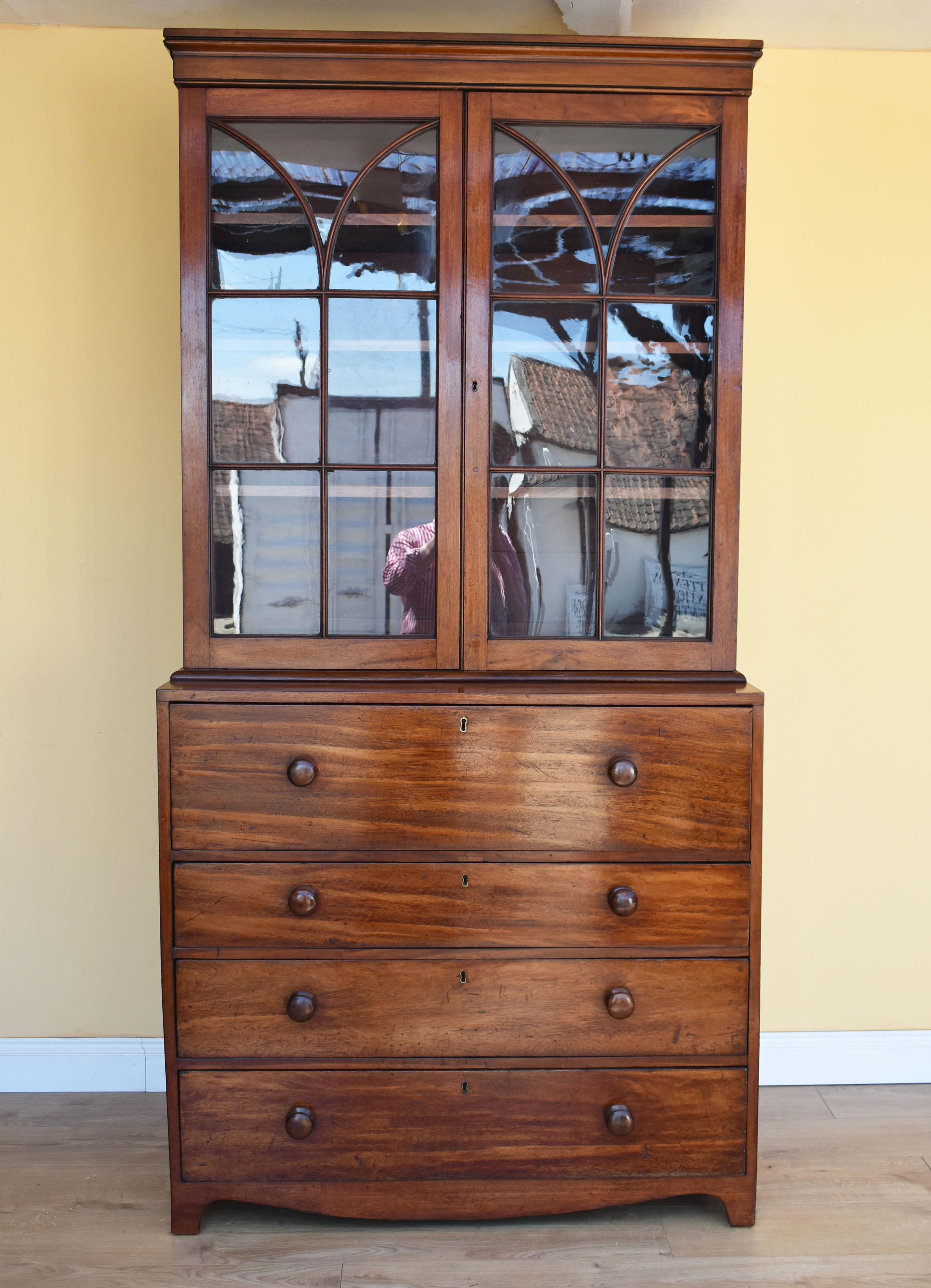 For sale is a good quality George III mahogany secretaire bookcase. The top of the bookcase has two glazed doors opening to reveal three adjustable shelves. Below this, is a secretaire drawer with a fall front, revealing a fitted interior comprising