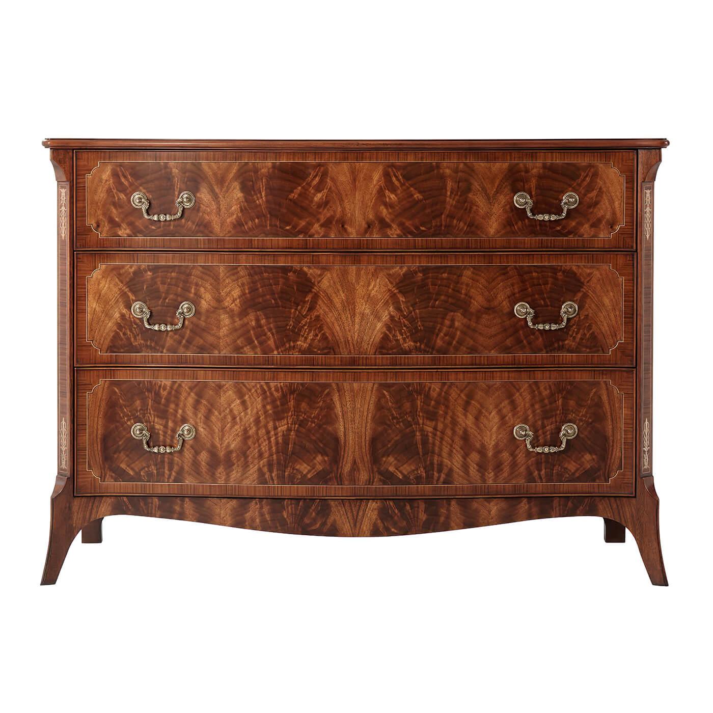 George III mahogany serpentine dresser, a flame mahogany and Morado banded chest of drawers with fine double stringing, the serpentine molded edge top above three cartouche banded graduated drawers with finely cast brass handles, the canted angles