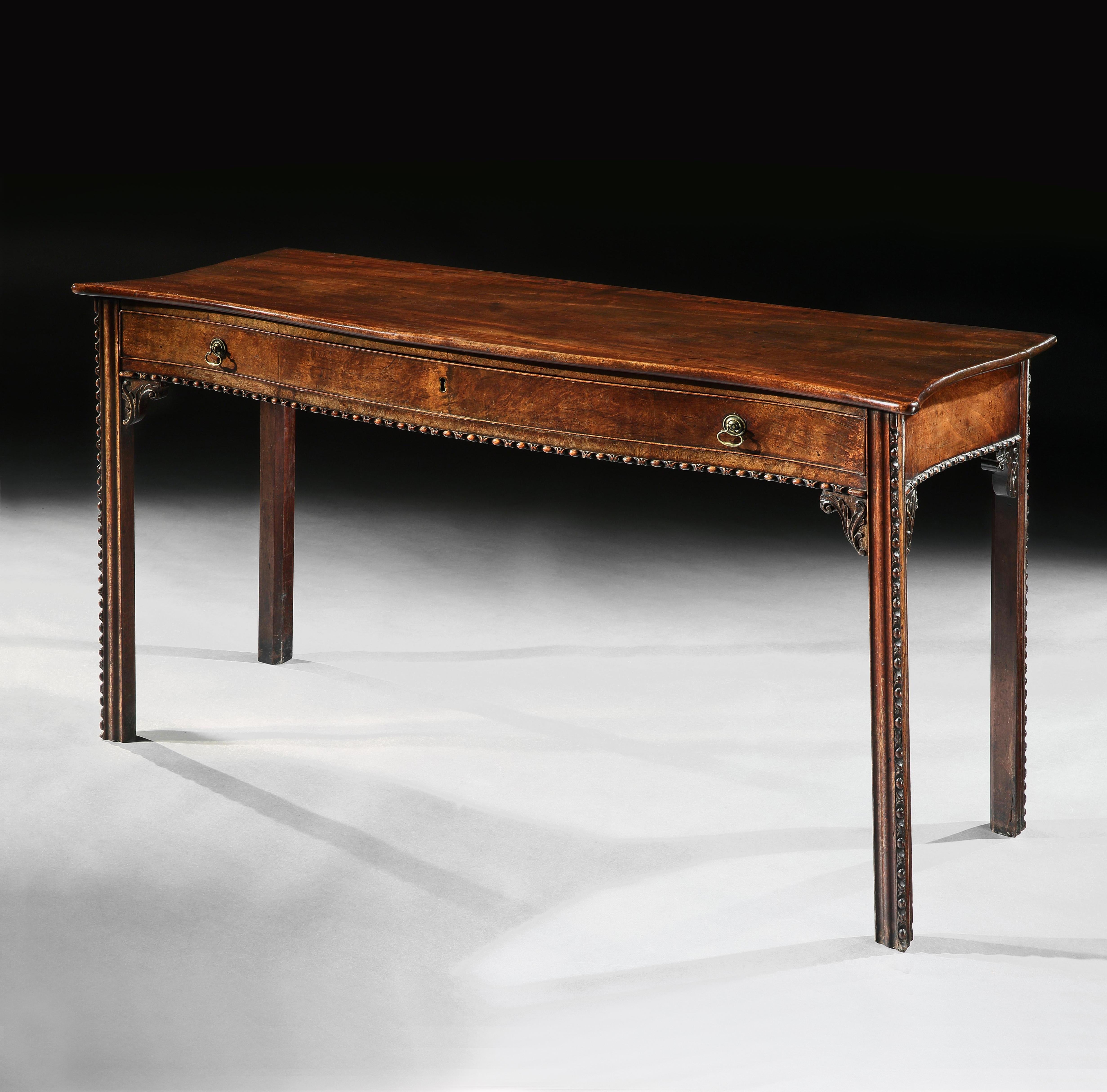 A fine and elegant mid-18th century Chippendale period mahogany serpentine side table with single drawer, retaining a wonderful color and patination, possibly by Wright & Elwick. 

English George III period, circa 1760.

The well chosen, figured