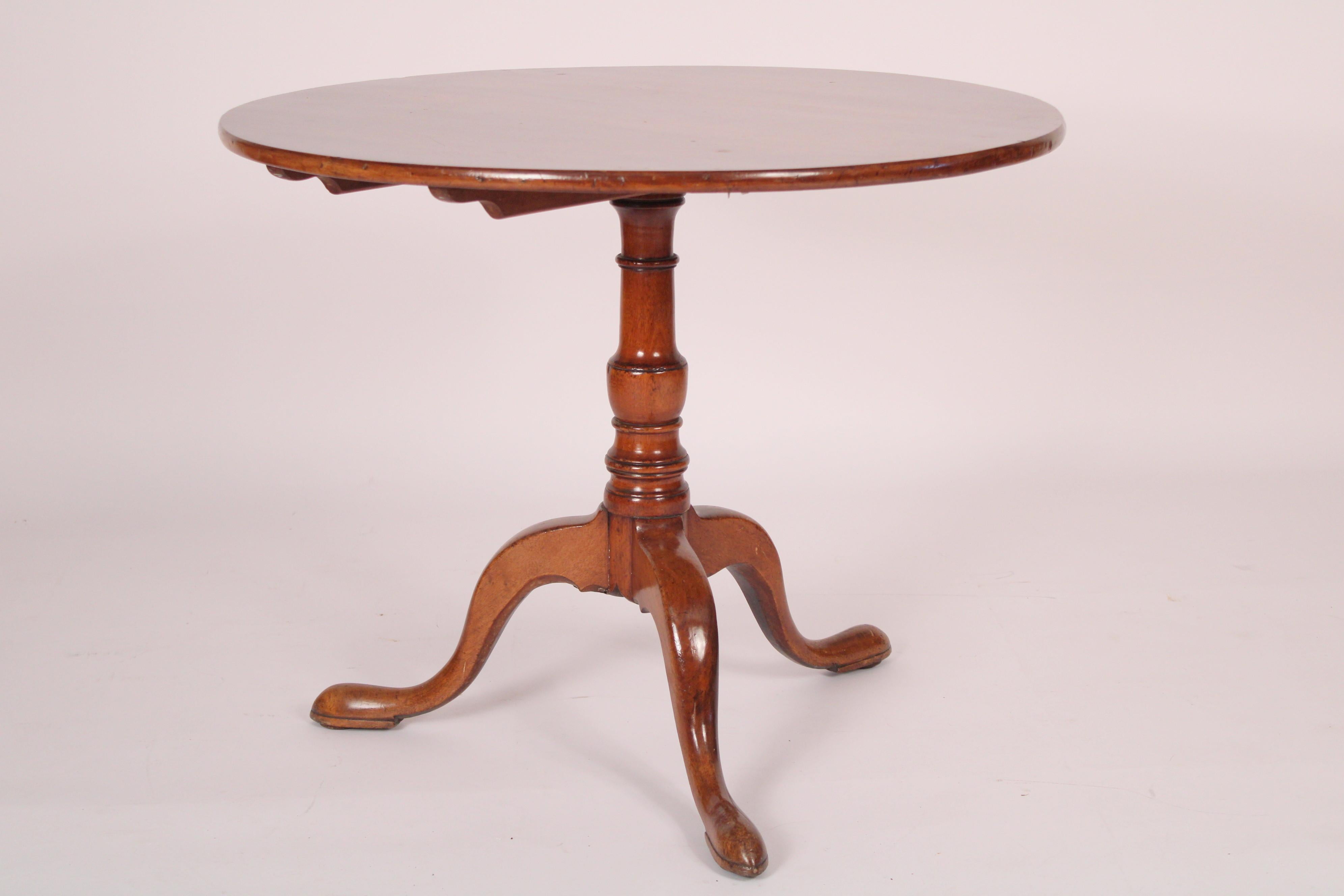 George III mahogany tilt top table with a single board top, late 18th century. With a 35