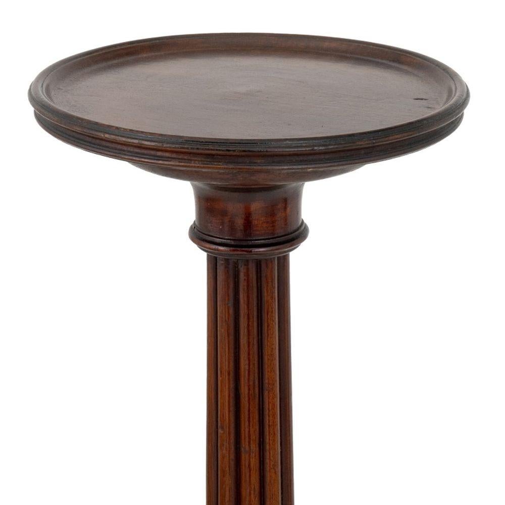 George III Mahogany Torchiere, with revolving circular top above reeded columnar stem above three cabriole legs. 53.5