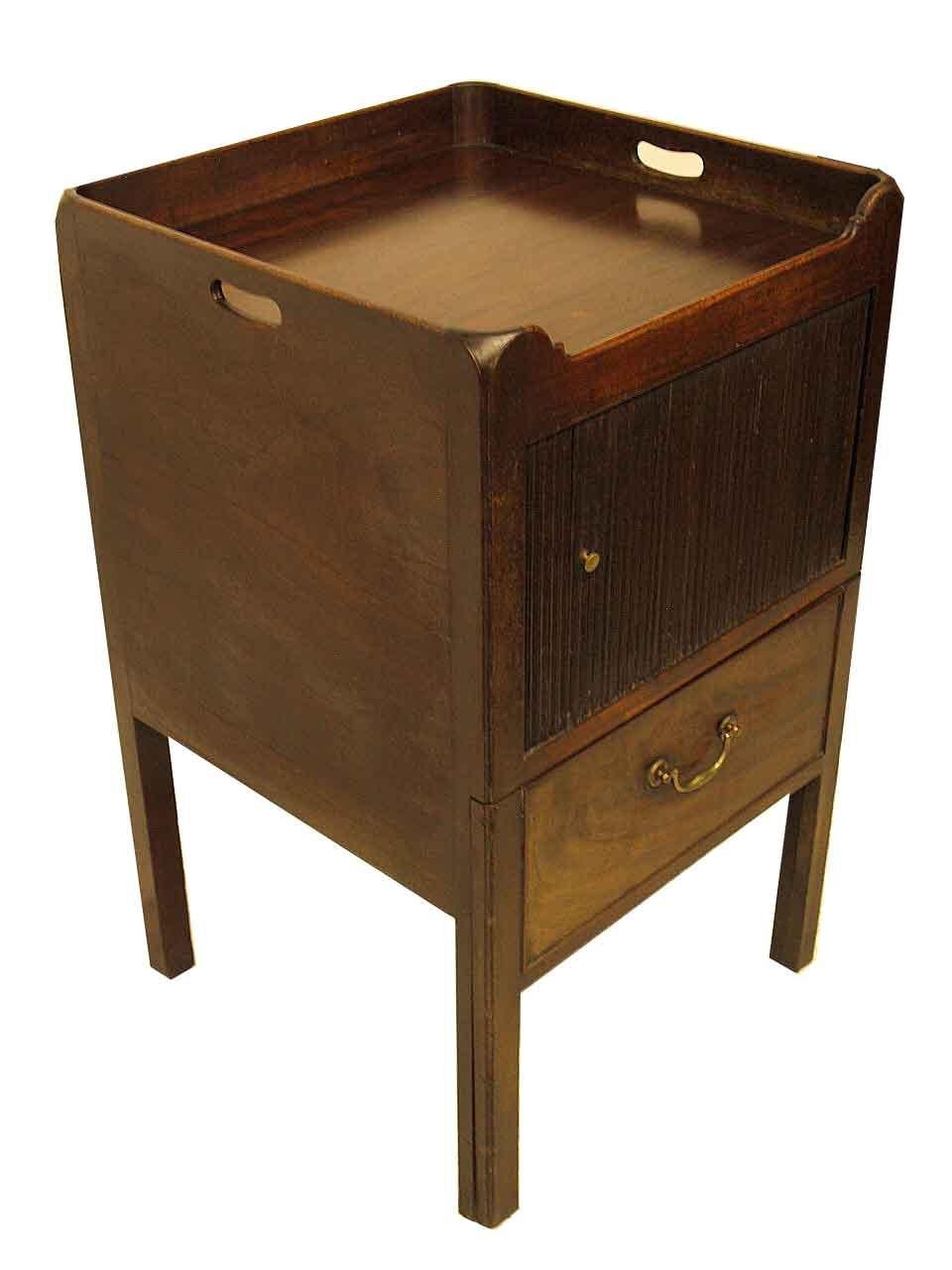 George III mahogany tray top commode, the gallery has openings on the sides for carrying; the sliding tambour front reveals open interior. The front legs were made in two pieces (see photo), originally in this lower section, there would have been a